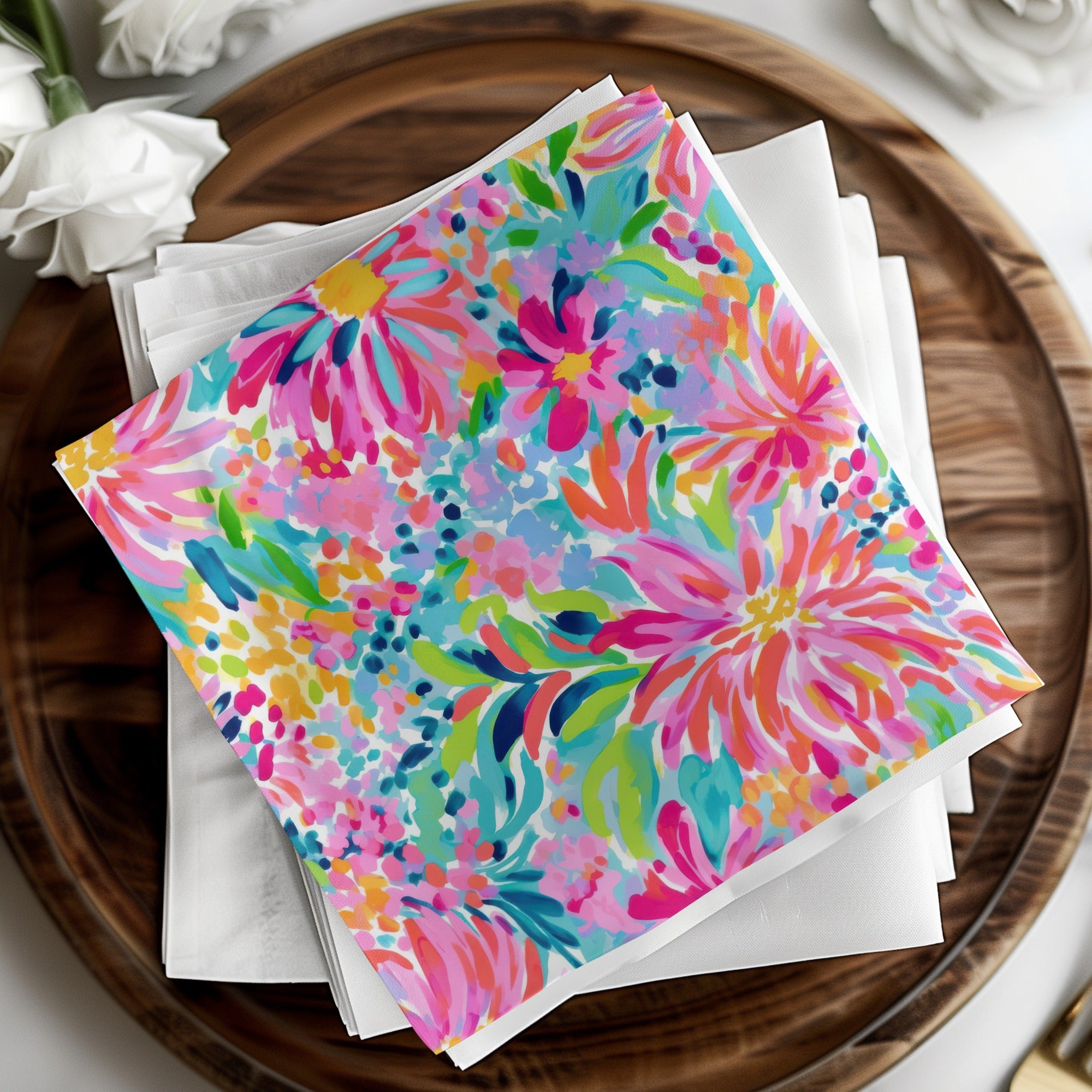 Colorful floral patterned napkins on a wooden tray.