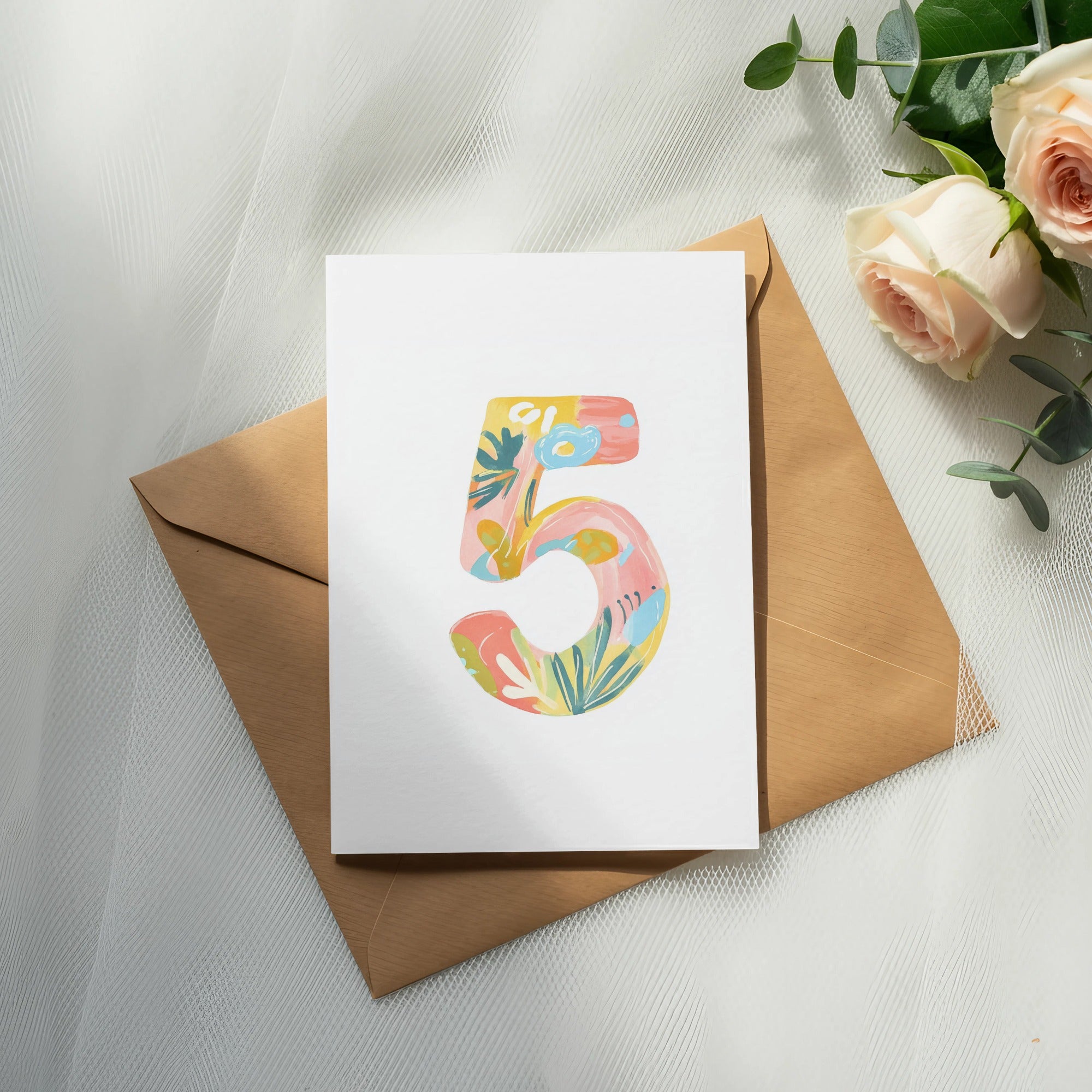 Card with colorful floral "5" design on brown envelope.