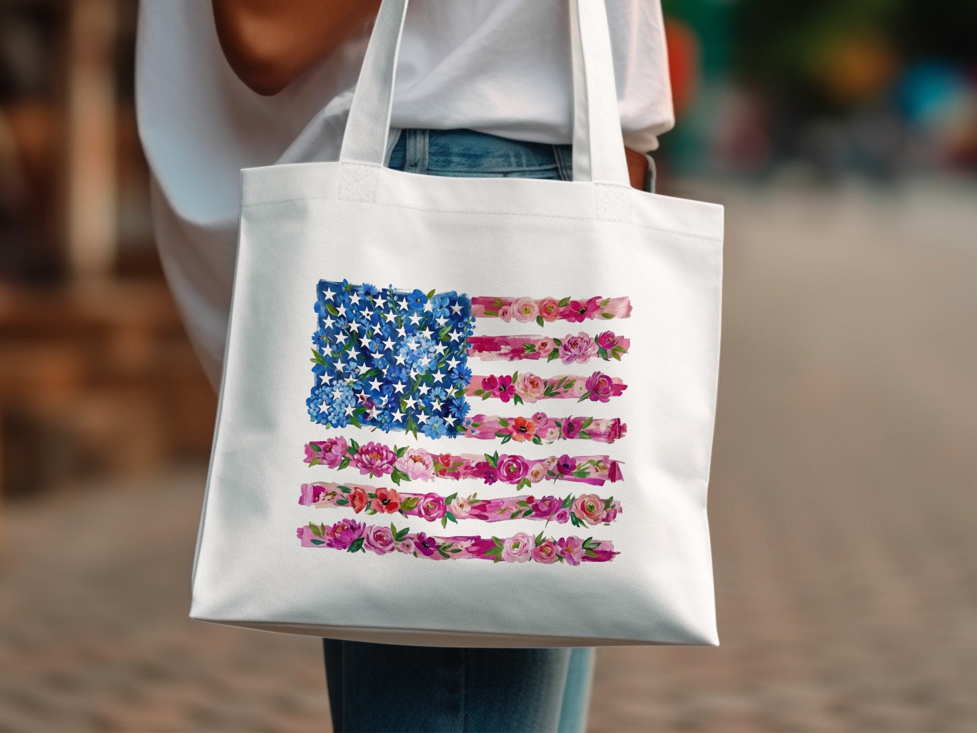 White tote bag with an American flag design made of flowers.
