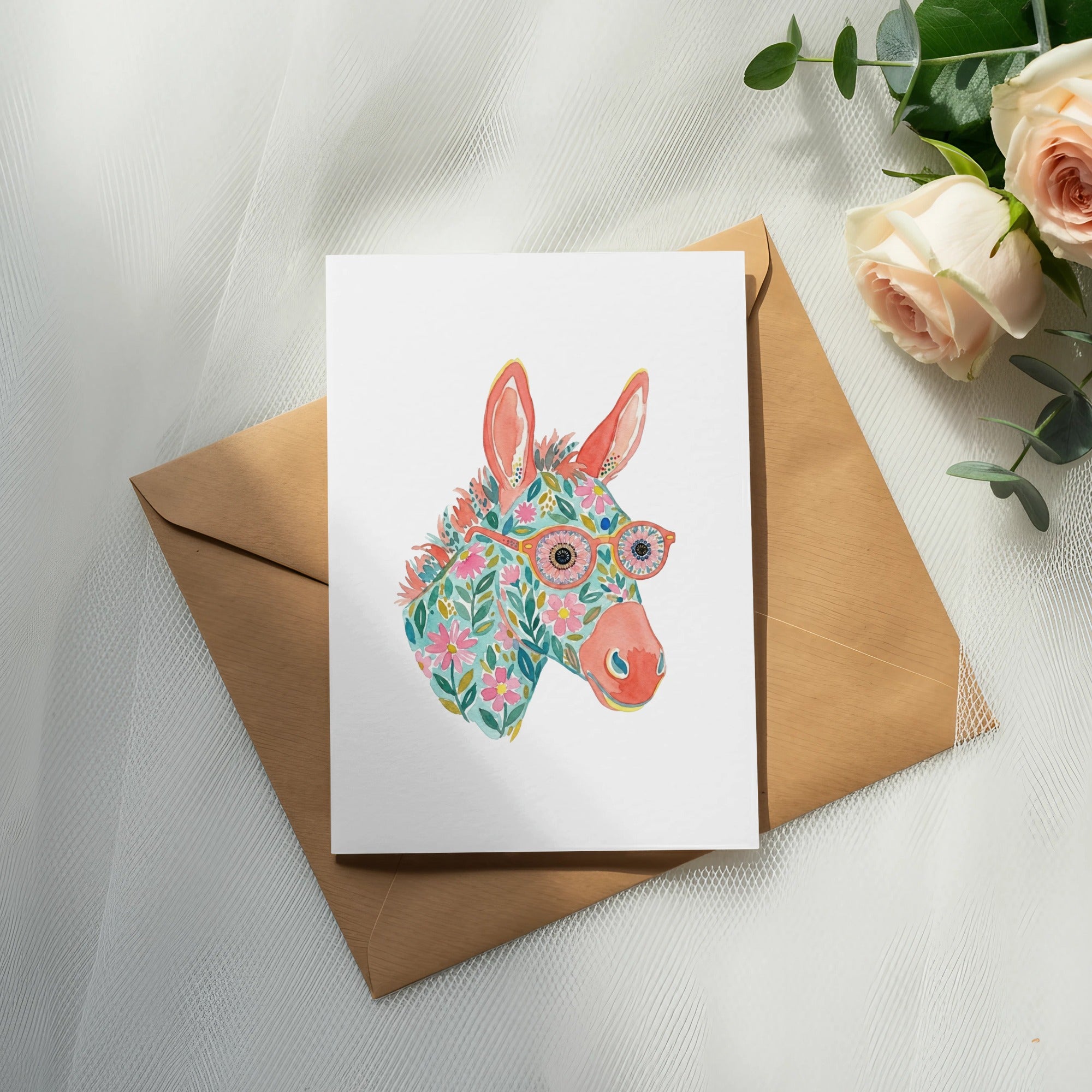Watercolor donkey with floral pattern and glasses on a card.