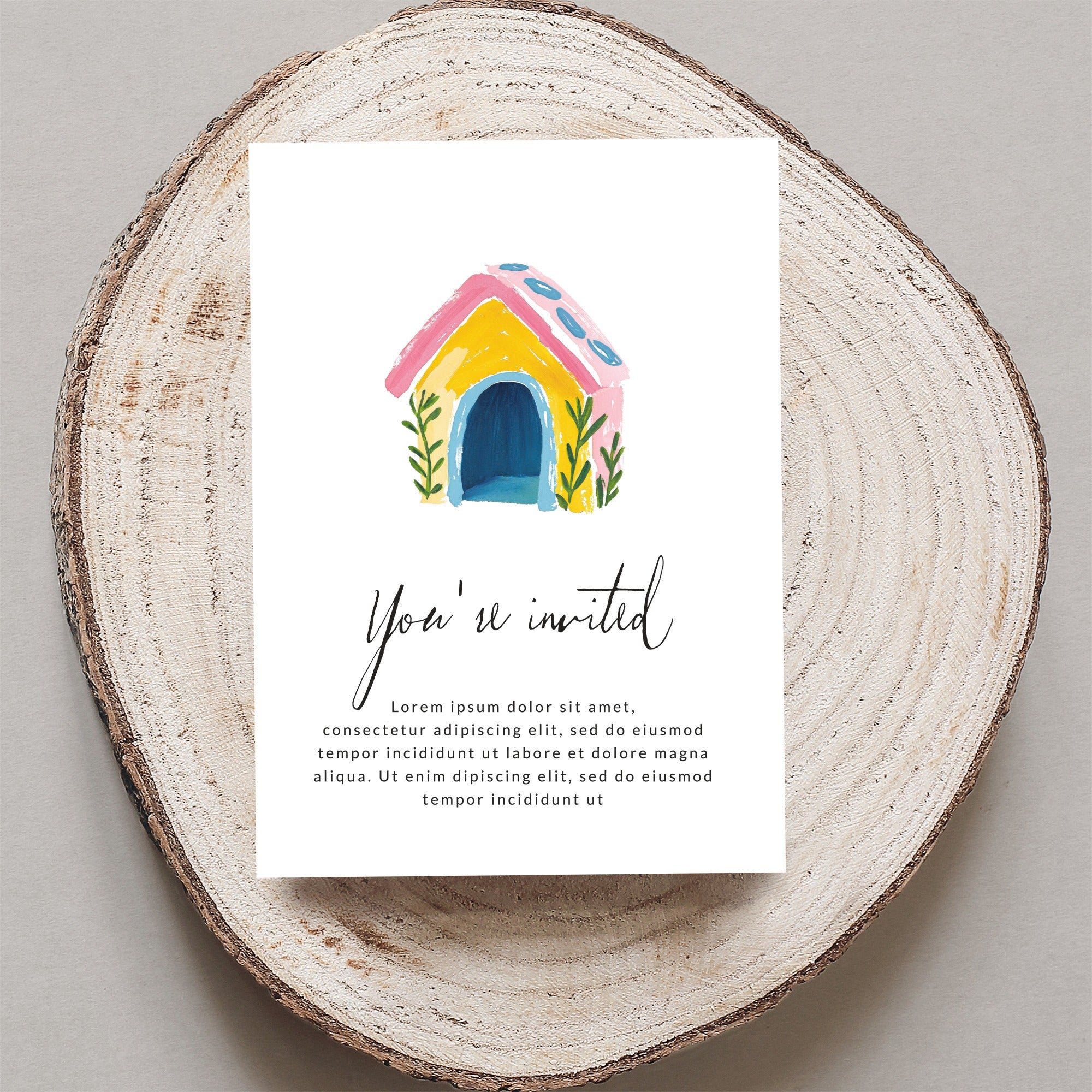 Invitation card with hand-drawn colorful dog house and "You're invited" text.