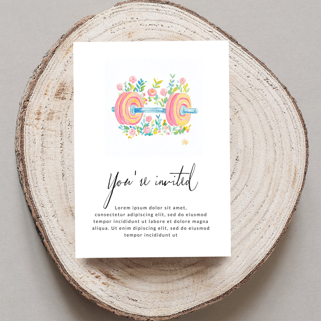 Watercolor barbell with floral accents on an invitation card.