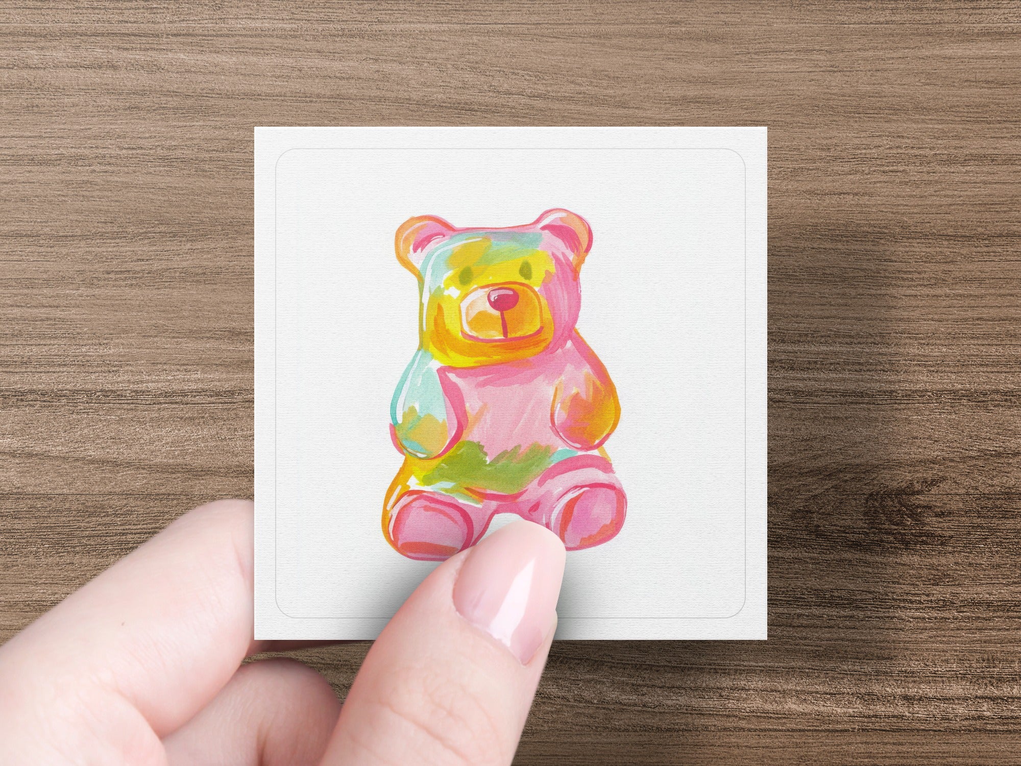 Gummy bear illustration with bright pink, yellow, and teal colors.