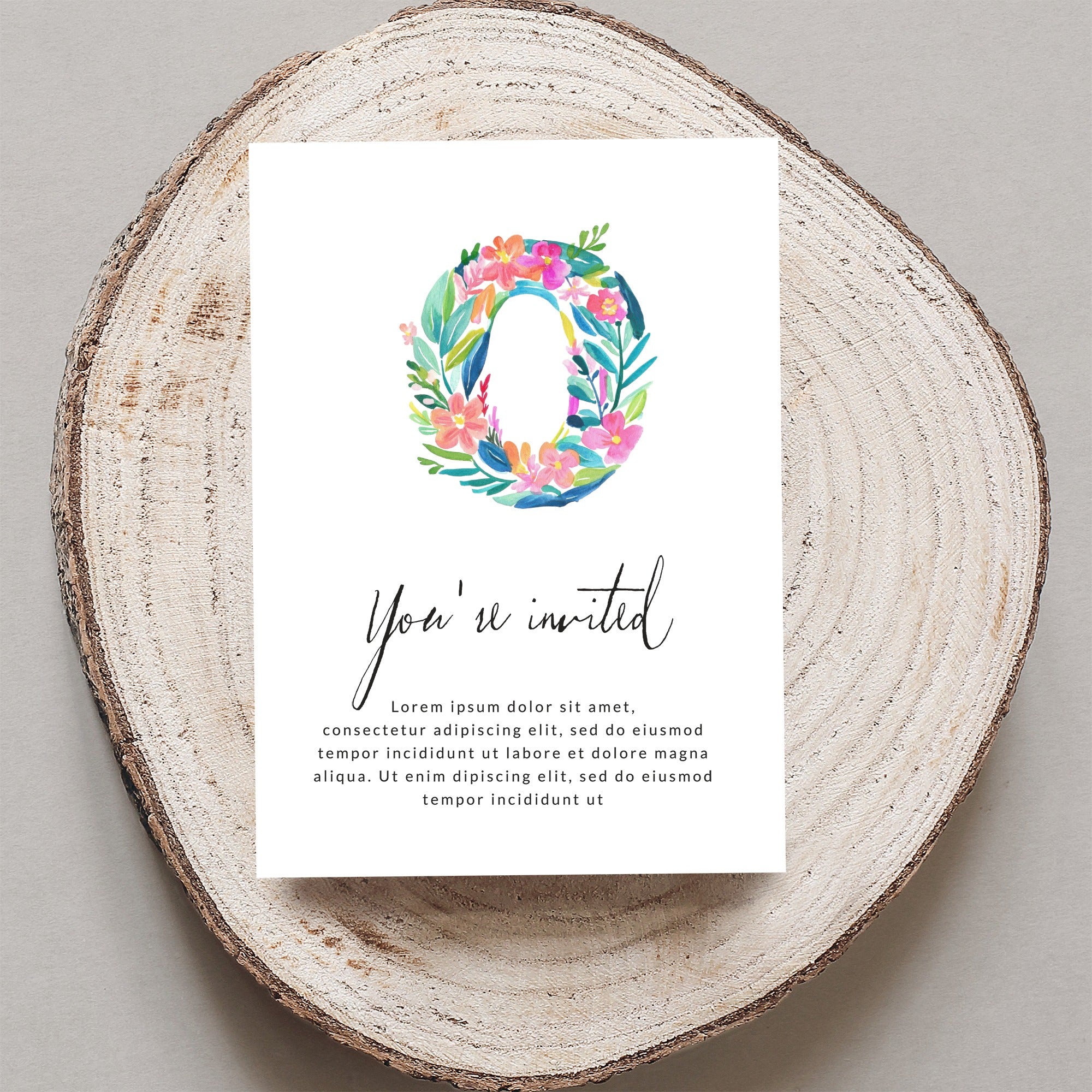 Invitation with floral "O" and "You're invited" text.