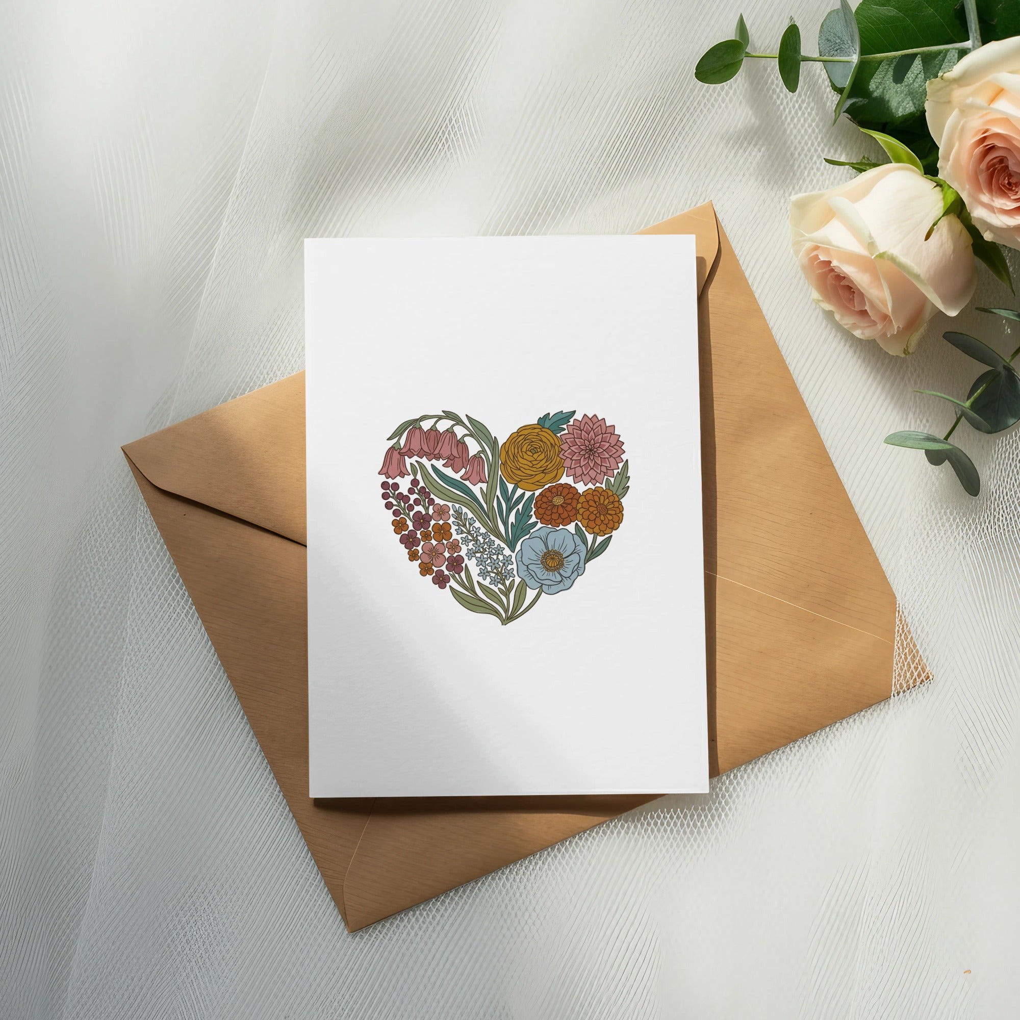 Blank card with a floral heart design on an open envelope.