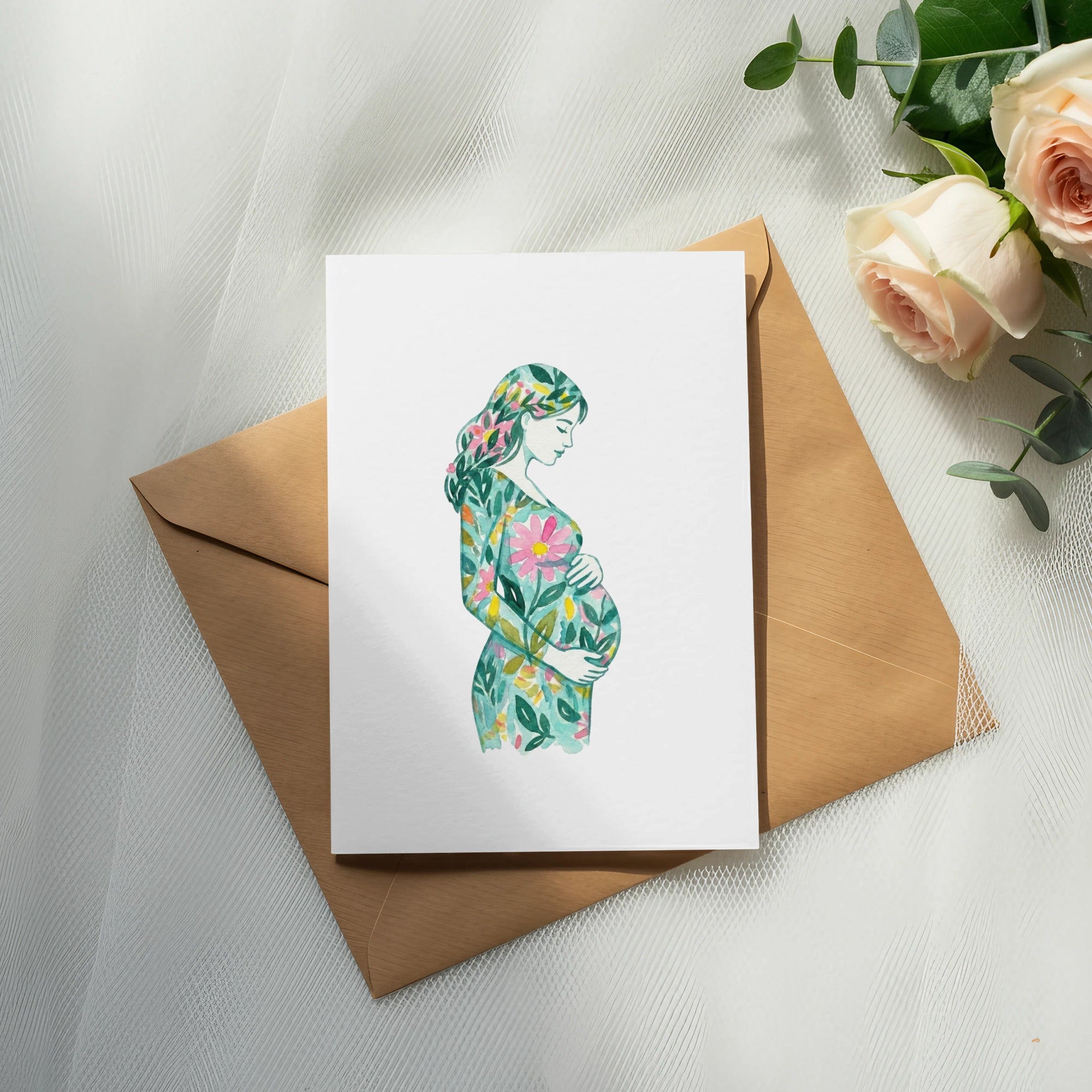 Watercolor illustration of pregnant woman in floral dress on card, with envelope and roses.