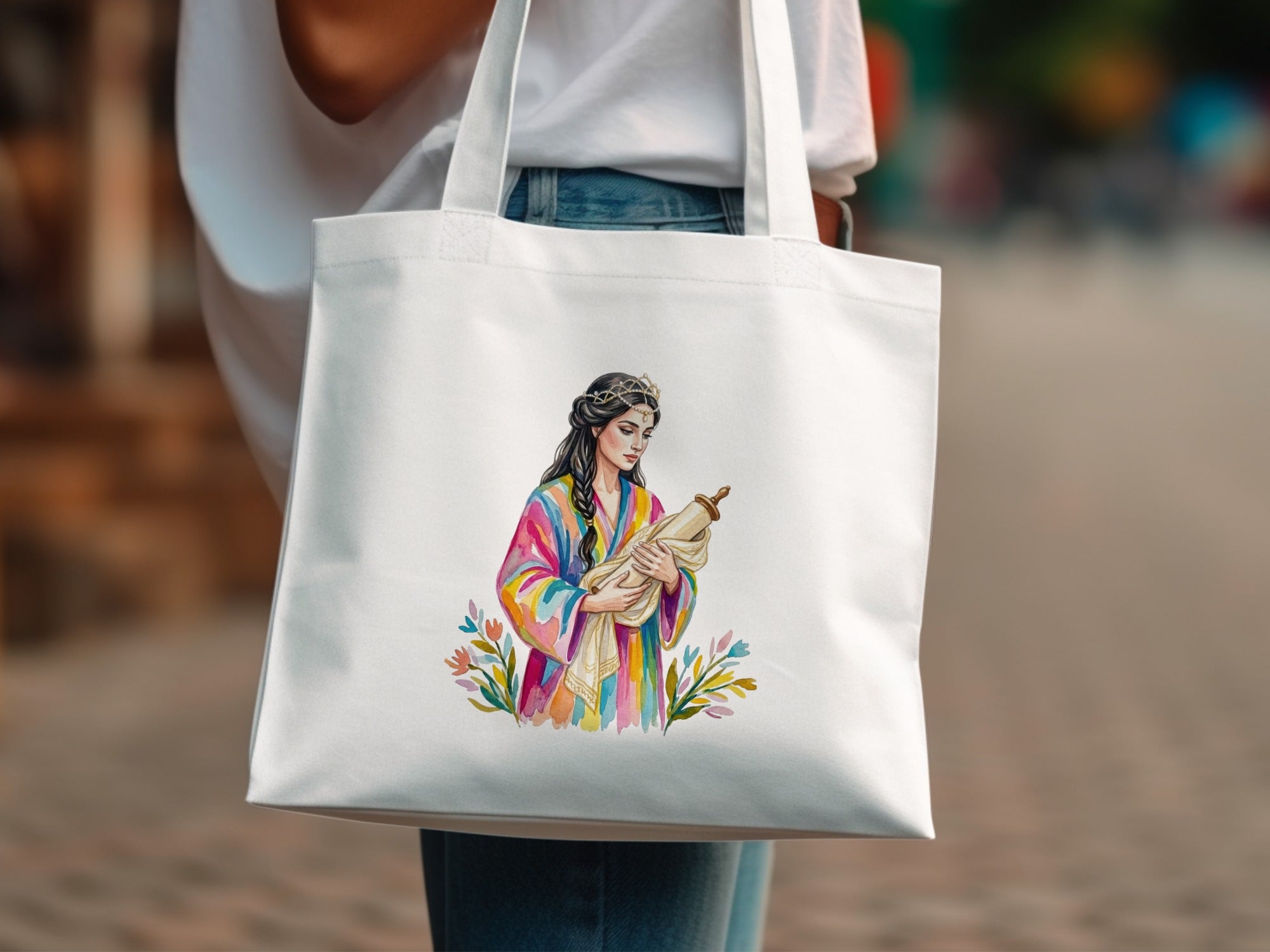 Tote bag with watercolor illustration of a woman in colorful robes holding a scroll.