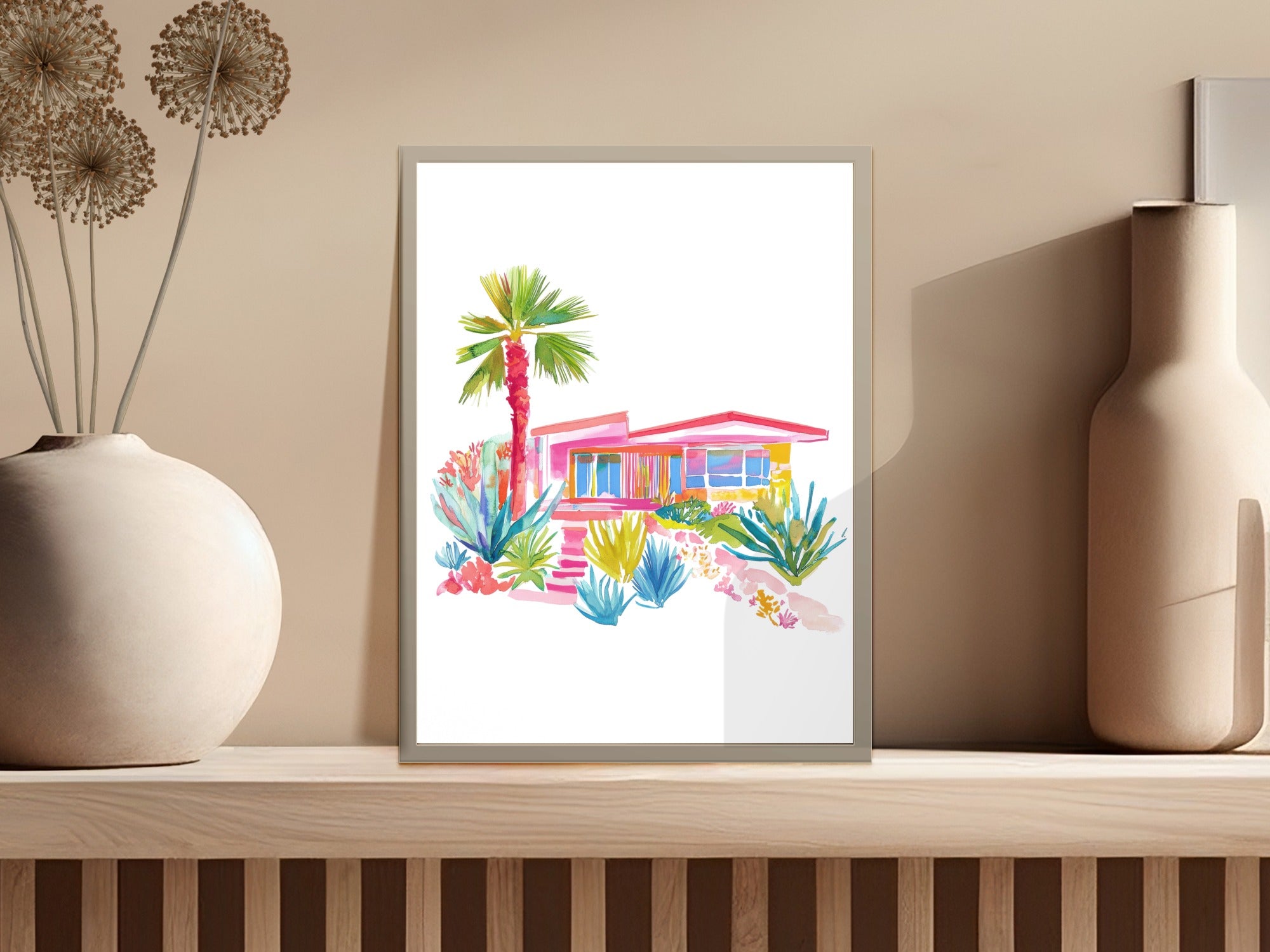 Watercolor painting of a vibrant mid-century modern house with palm trees and colorful plants.