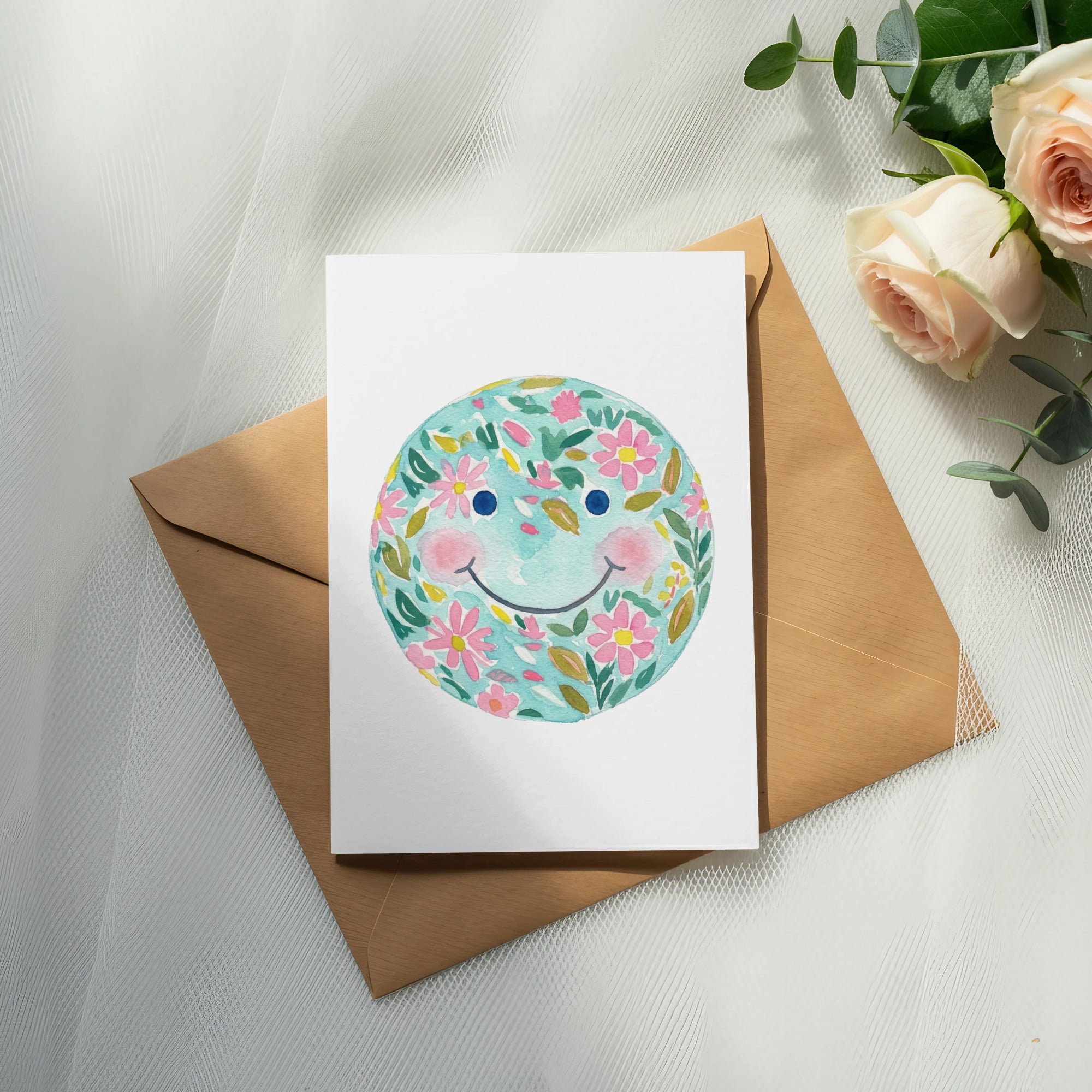 Card with a smiling flower globe design on a brown envelope.