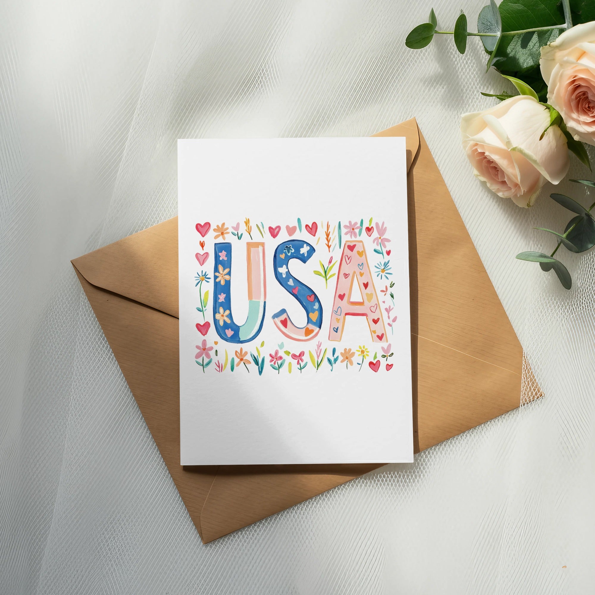 Card with colorful "USA" lettering and floral accents on envelope.