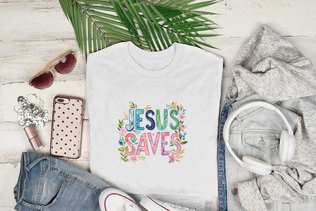 White t-shirt with "Jesus Saves" in colorful floral letters.