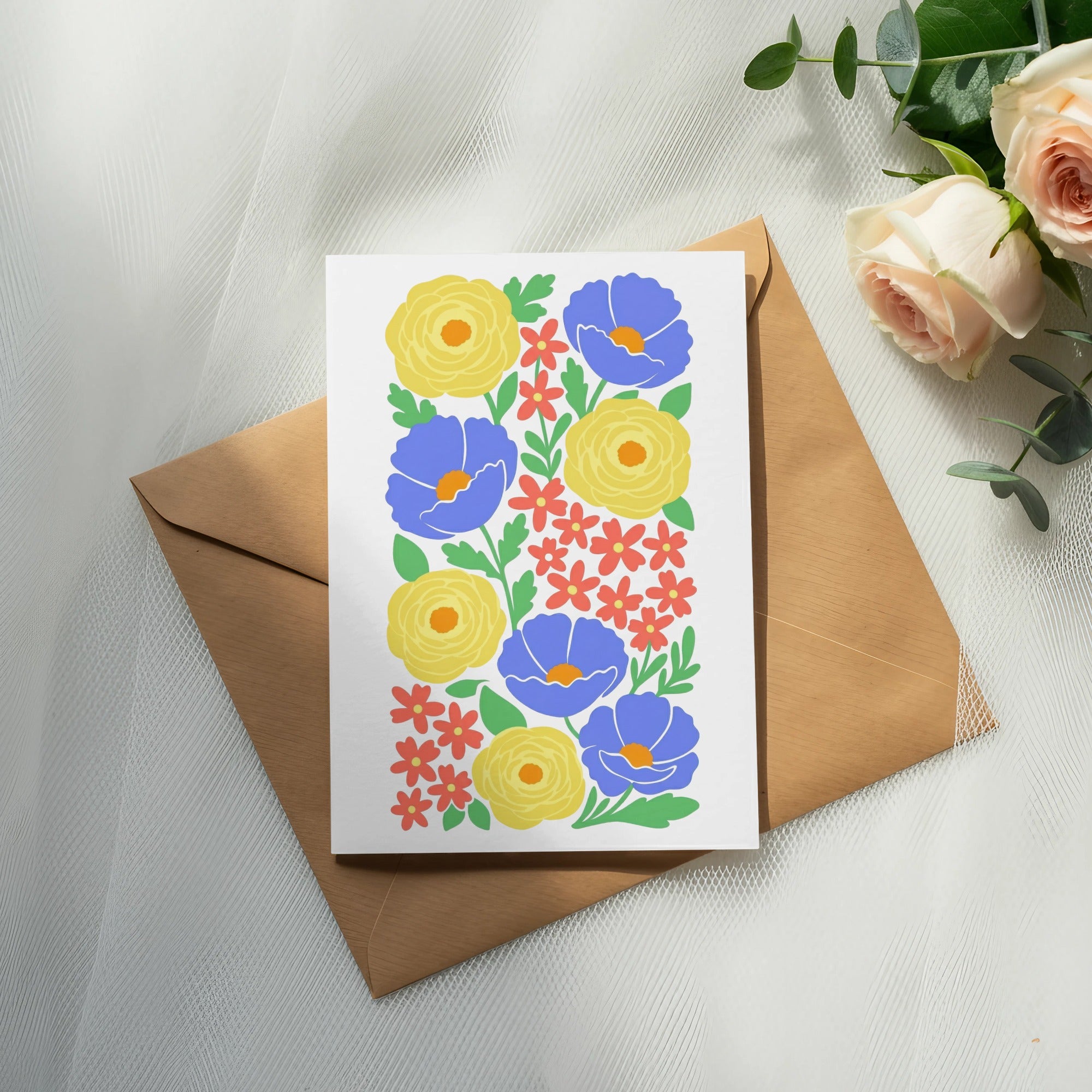 White greeting card with colorful floral illustration on brown envelope.