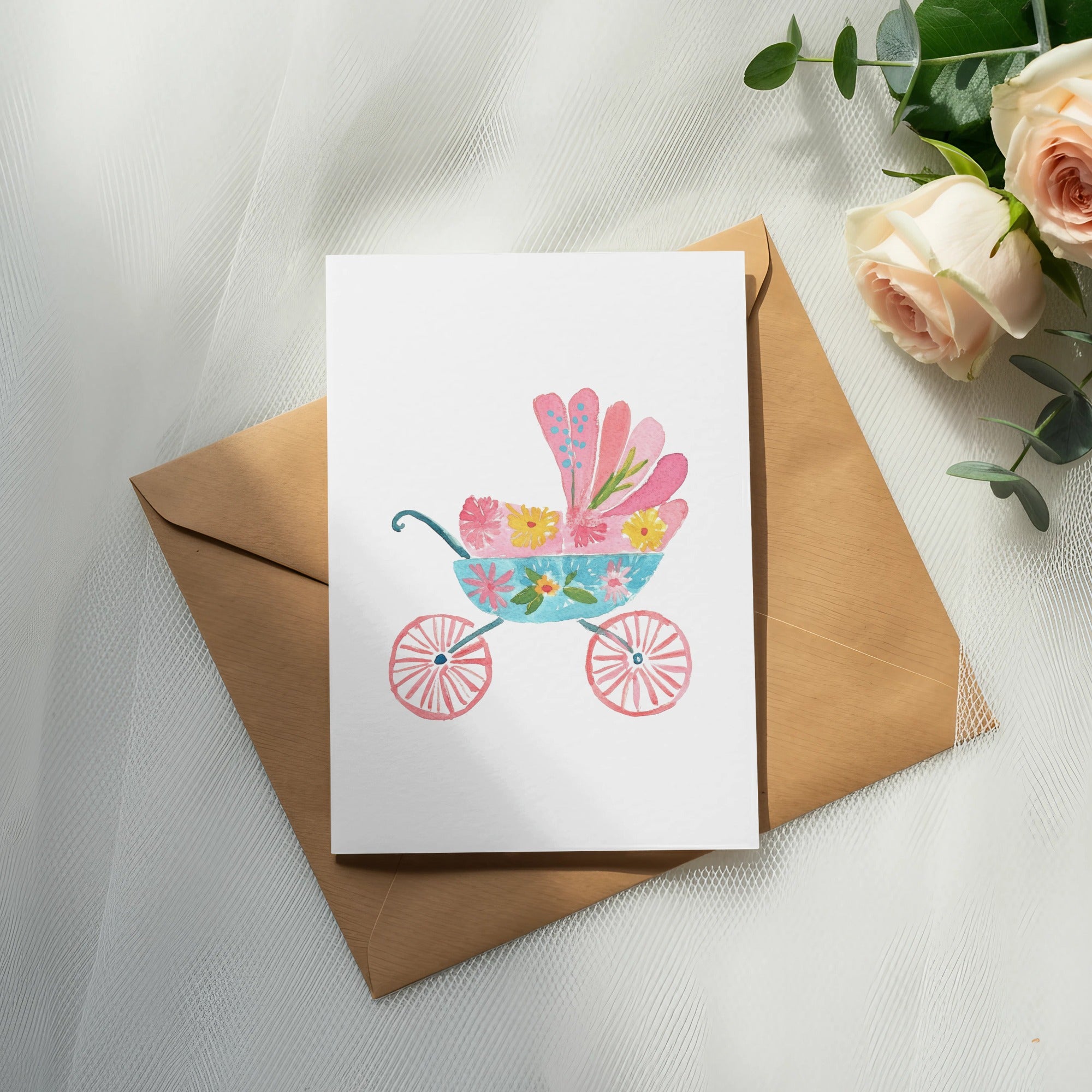Watercolor illustration of a pink and blue baby carriage with floral details.