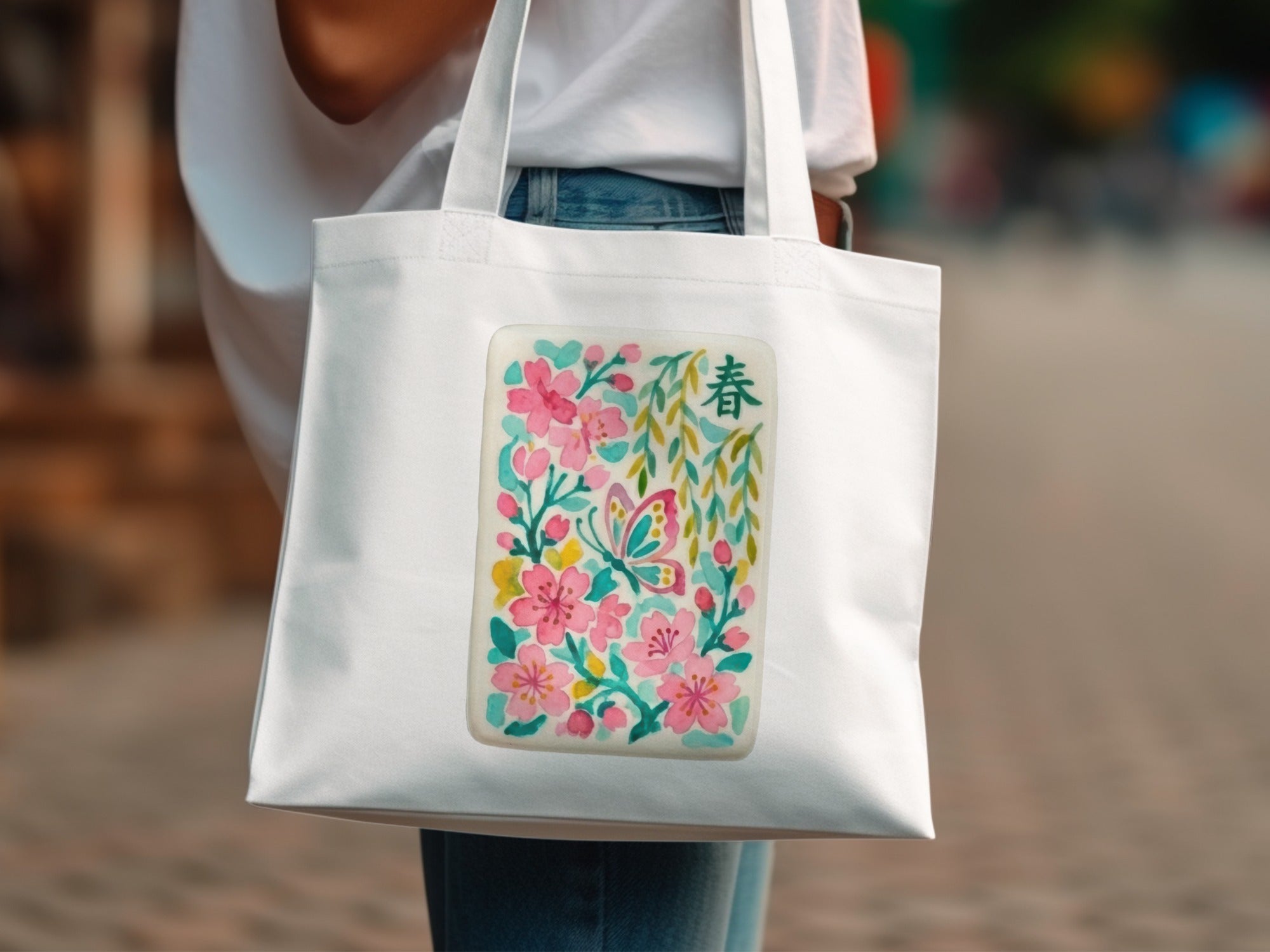 White canvas tote bag with floral and butterfly design, featuring Chinese character.