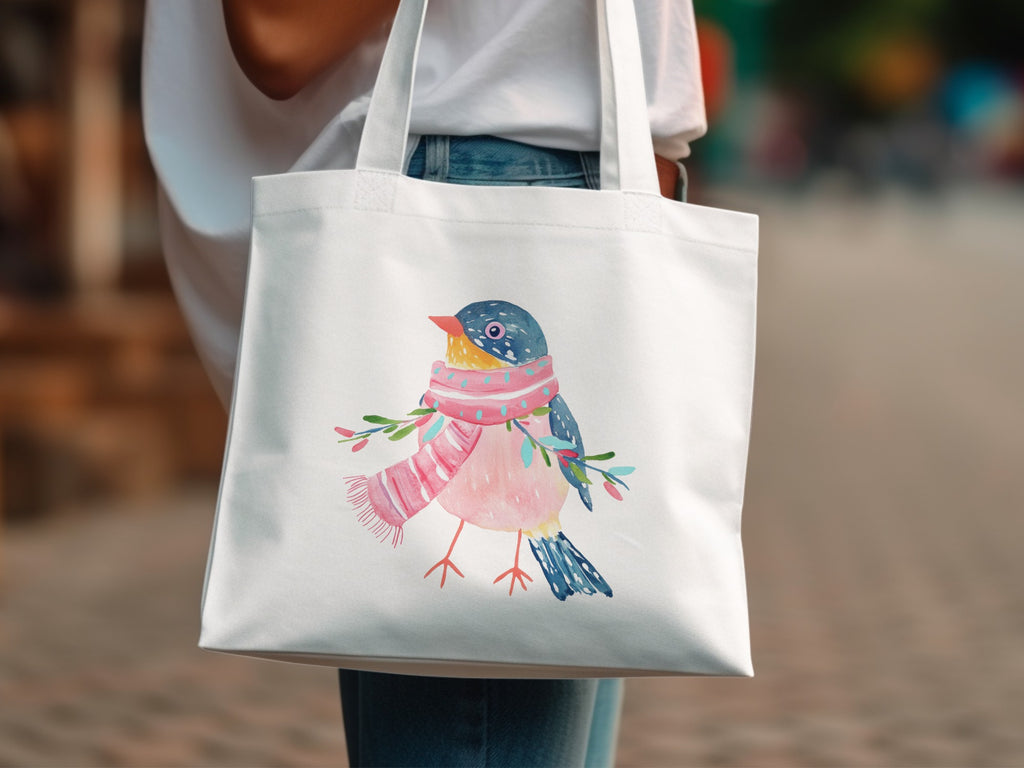 White tote bag with a watercolor illustration of a bird wearing a pink scarf.