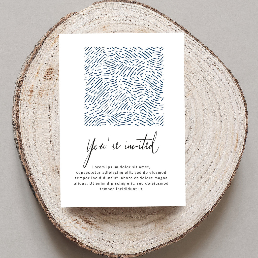 Invitation card with "You're invited" text and abstract blue pattern on wood slice.