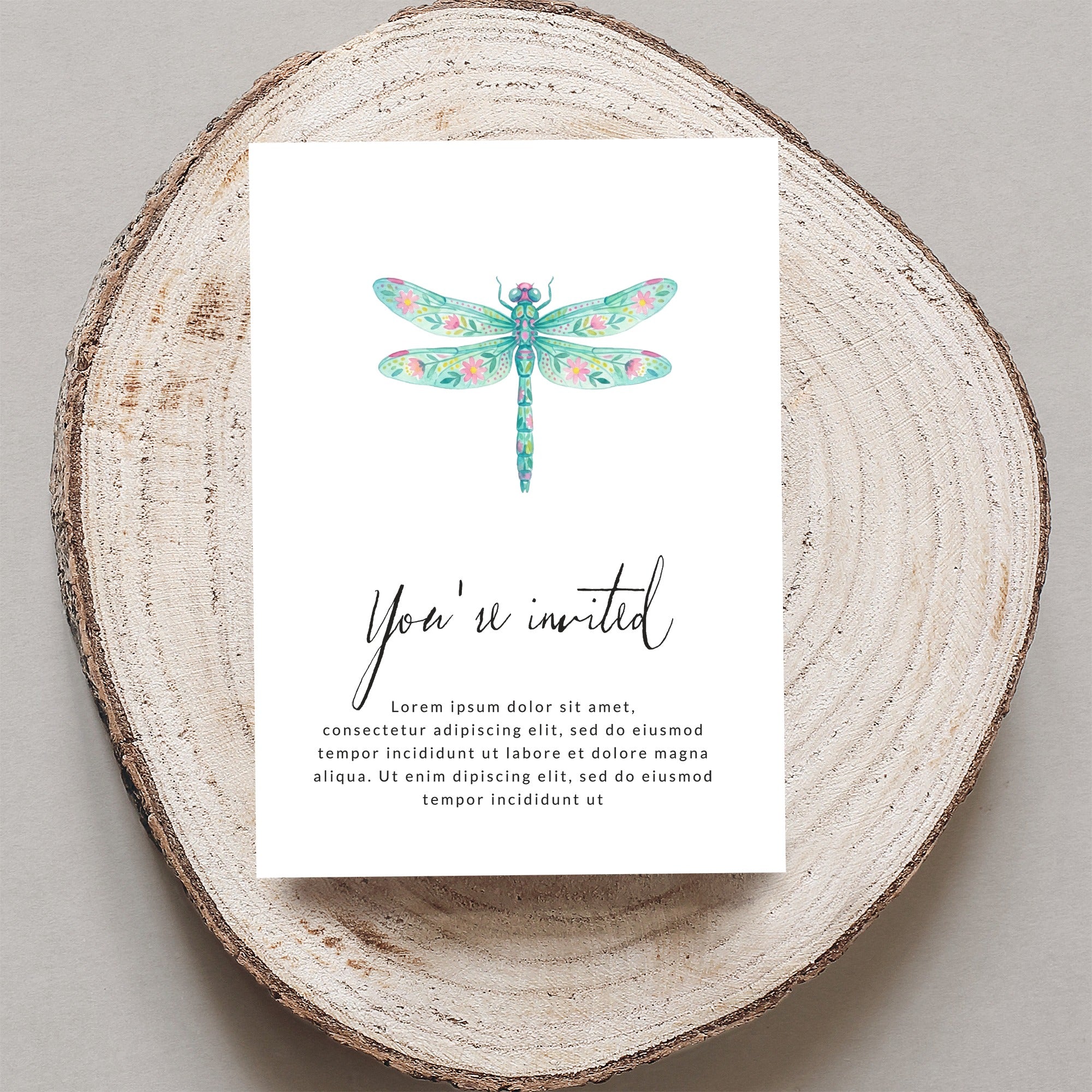 Invitation card with colorful dragonfly and placeholder text.