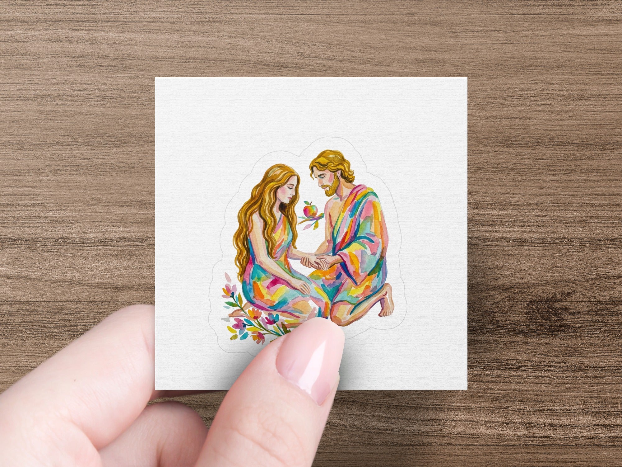 Couple in colorful robes holding an apple, surrounded by flowers.