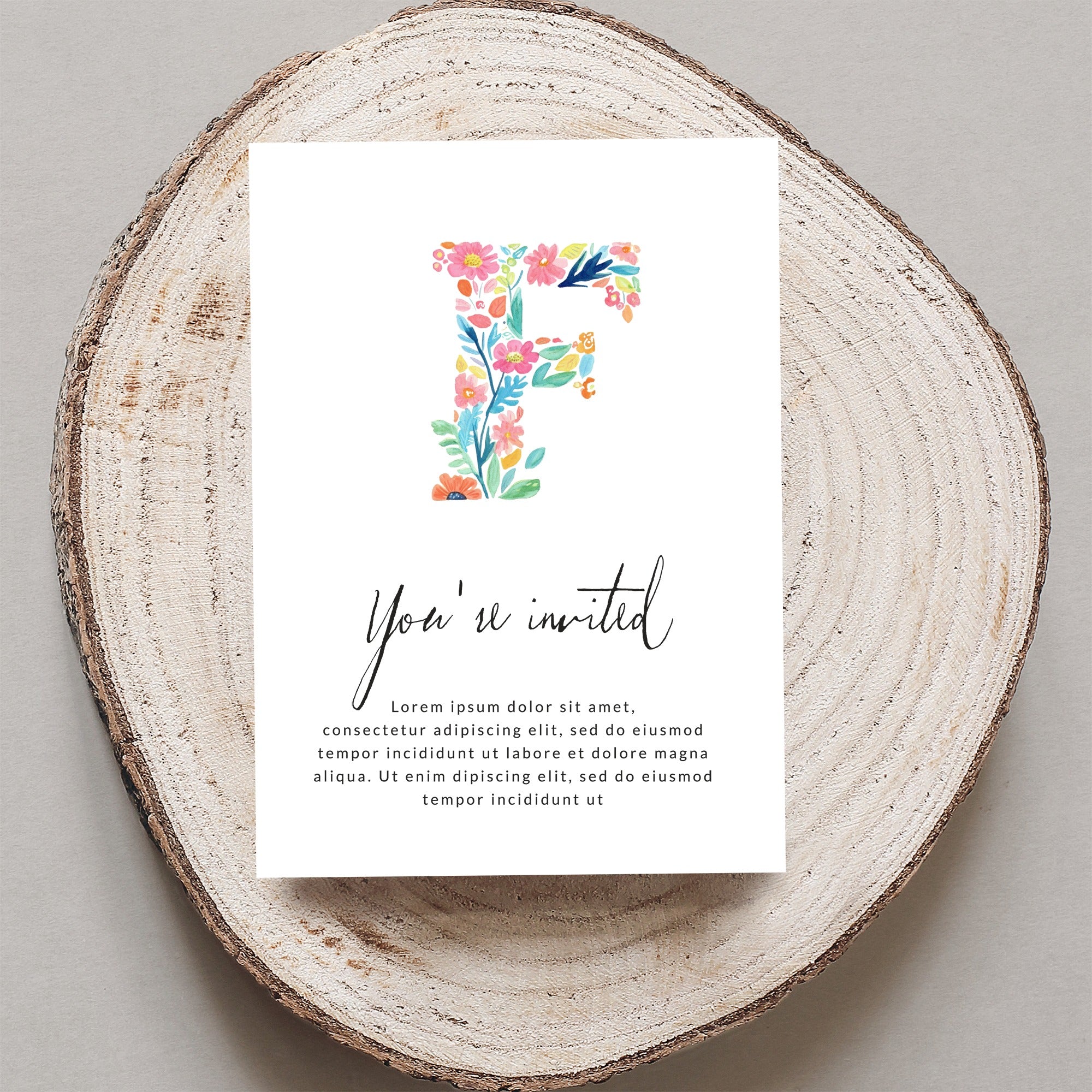 "You're invited" card with floral letter F and placeholder text.