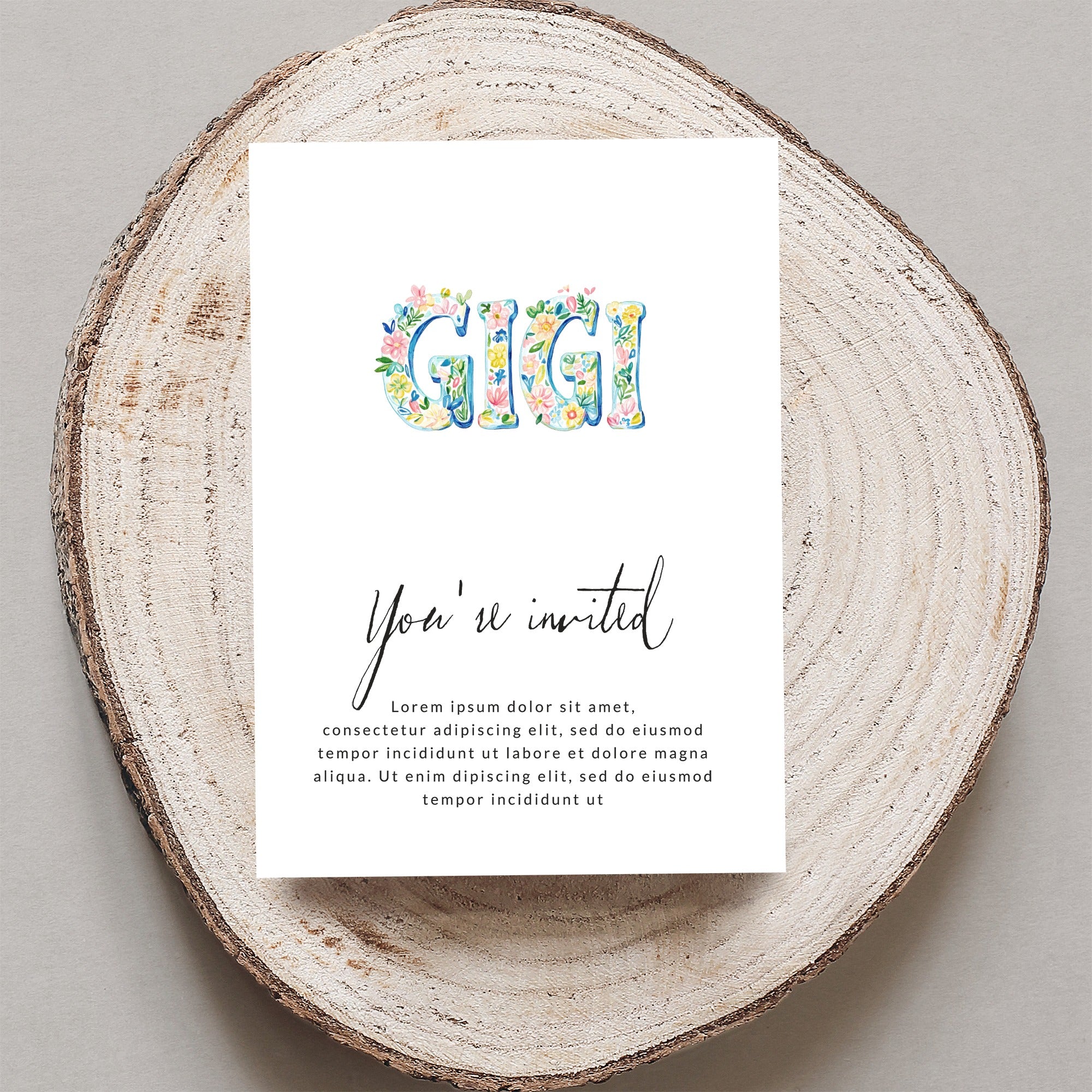 GIGI invitation with floral letters, reading "You're invited" and placeholder text.