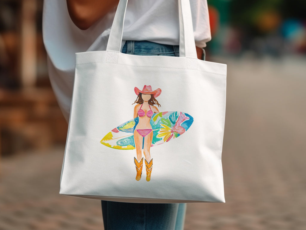 White tote bag with watercolor illustration of a surfer girl in a cowboy hat and boots.