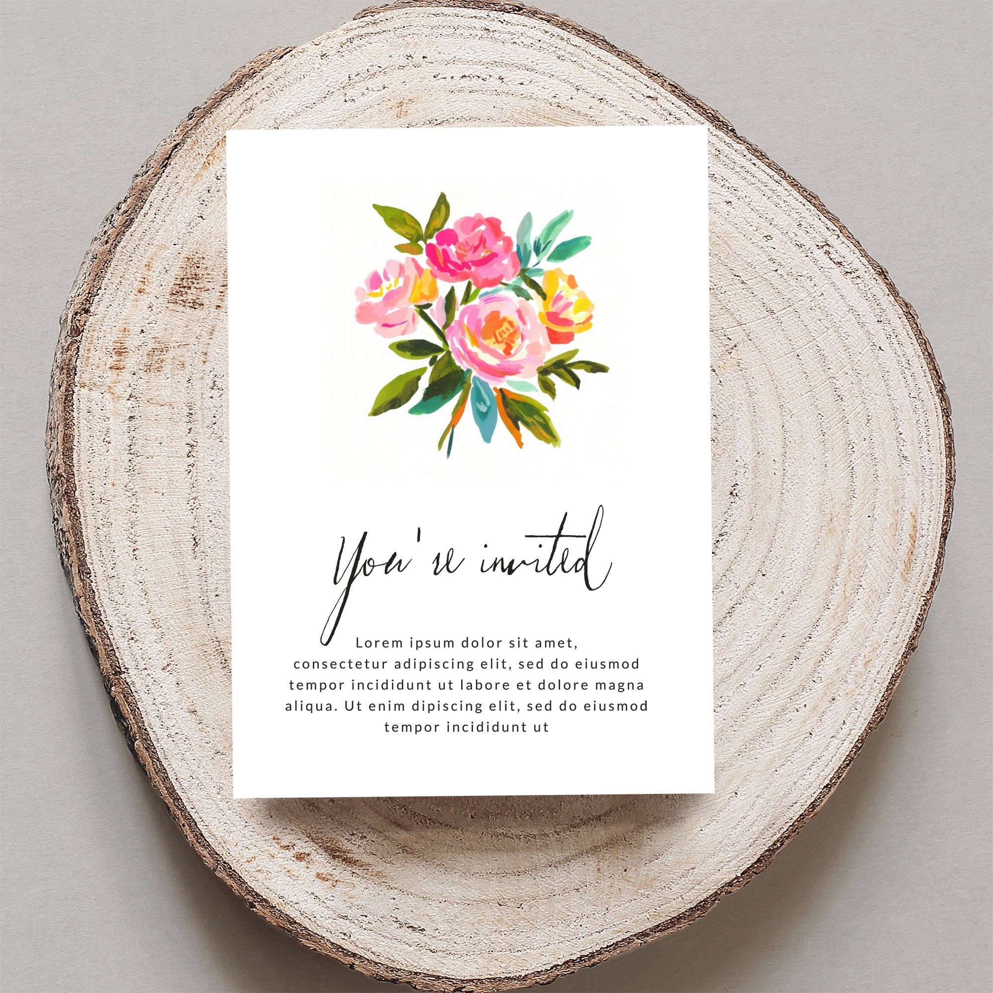 Invitation card with watercolor flowers and "You're invited" text.
