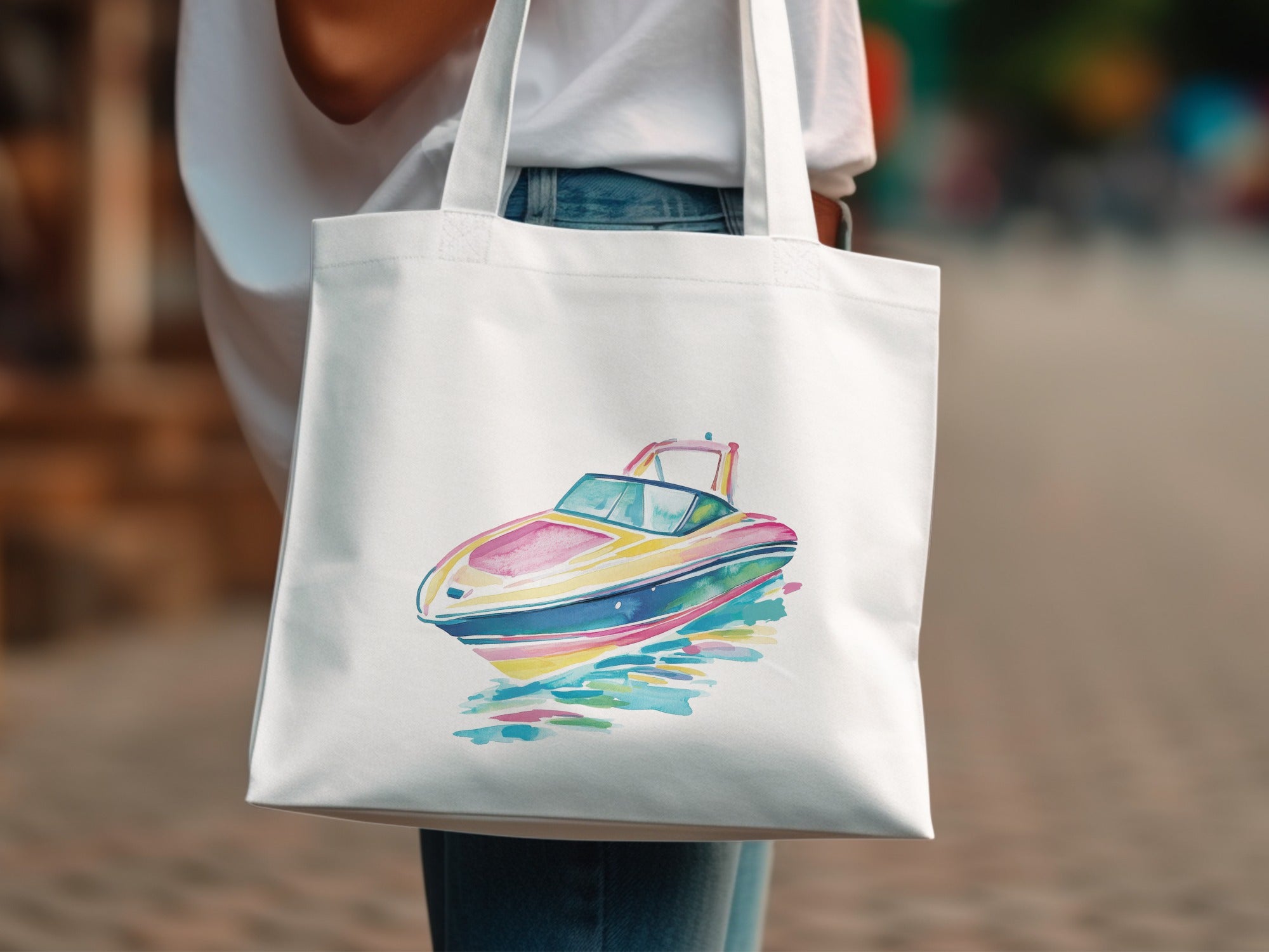 White tote bag featuring a colorful watercolor illustration of a speed boat.