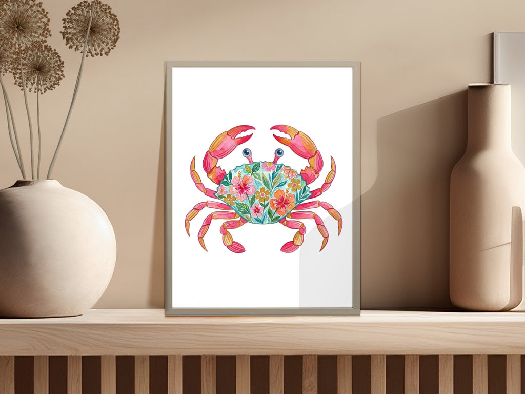 Colorful crab illustration with floral accents in a framed picture.
