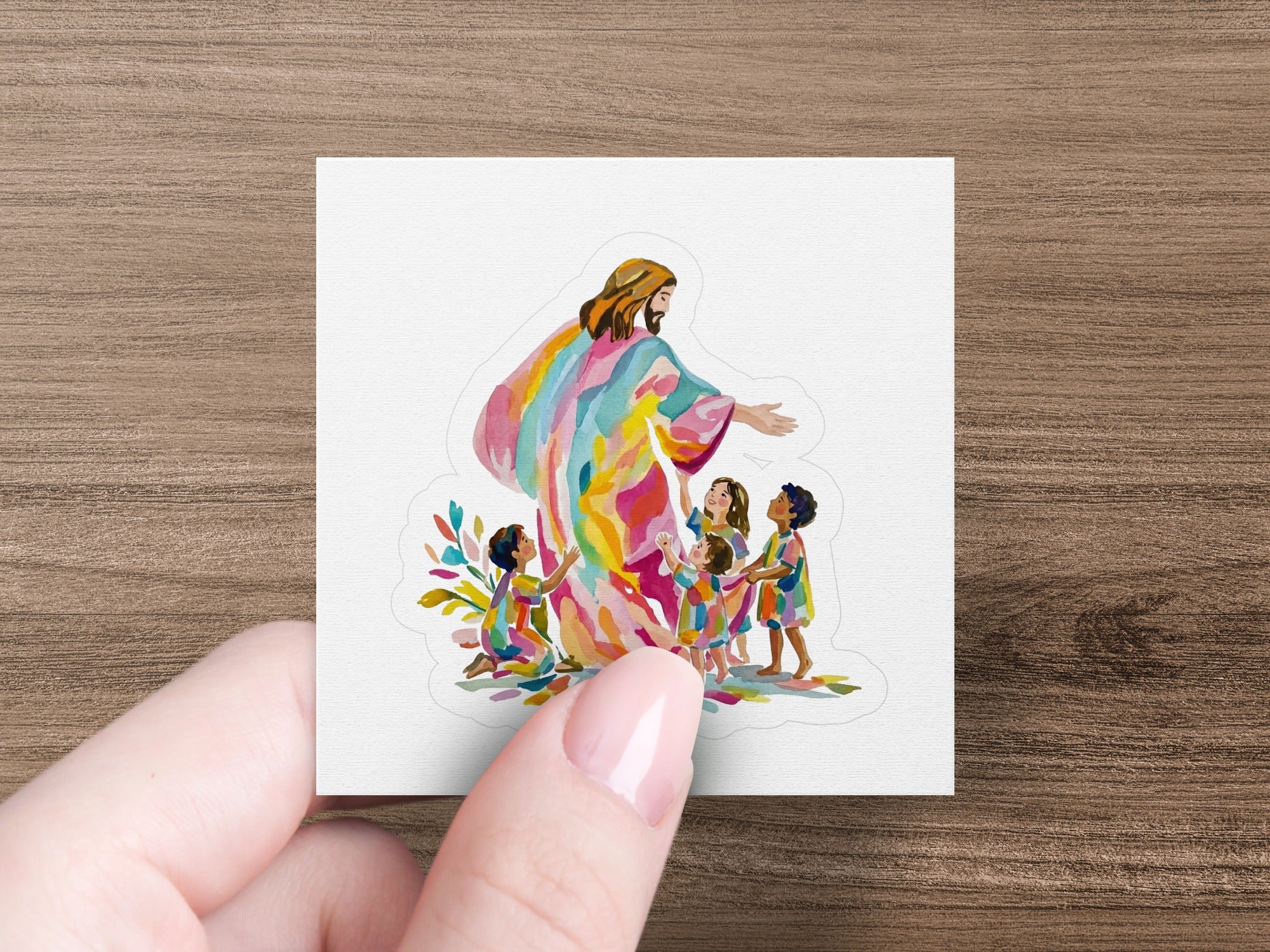 Jesus in colorful robe embraces diverse group of children.