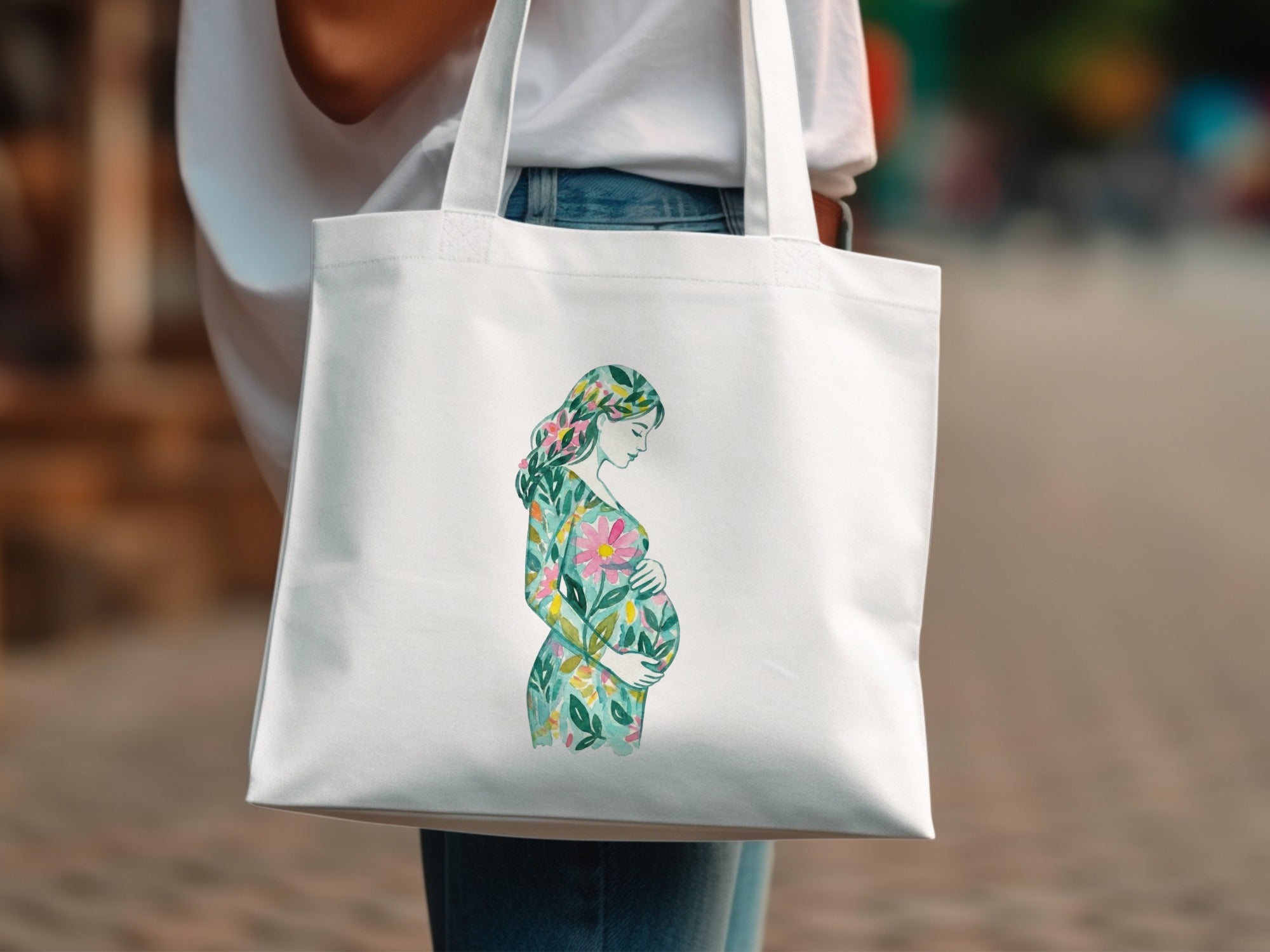 White tote bag with watercolor floral pregnant woman illustration.