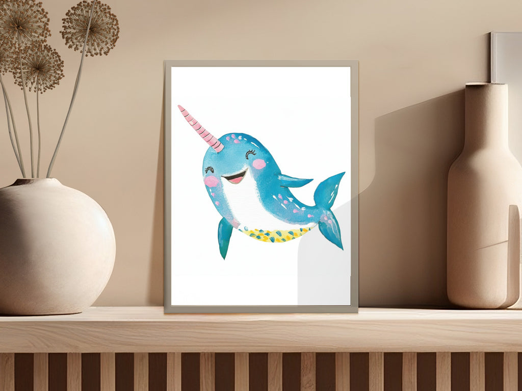 Whimsical blue narwhal with pink horn and polka dots, in a frame.