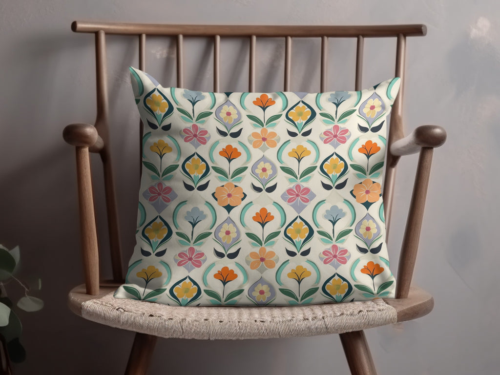 Throw pillow with a colorful floral geometric pattern on a wooden chair.