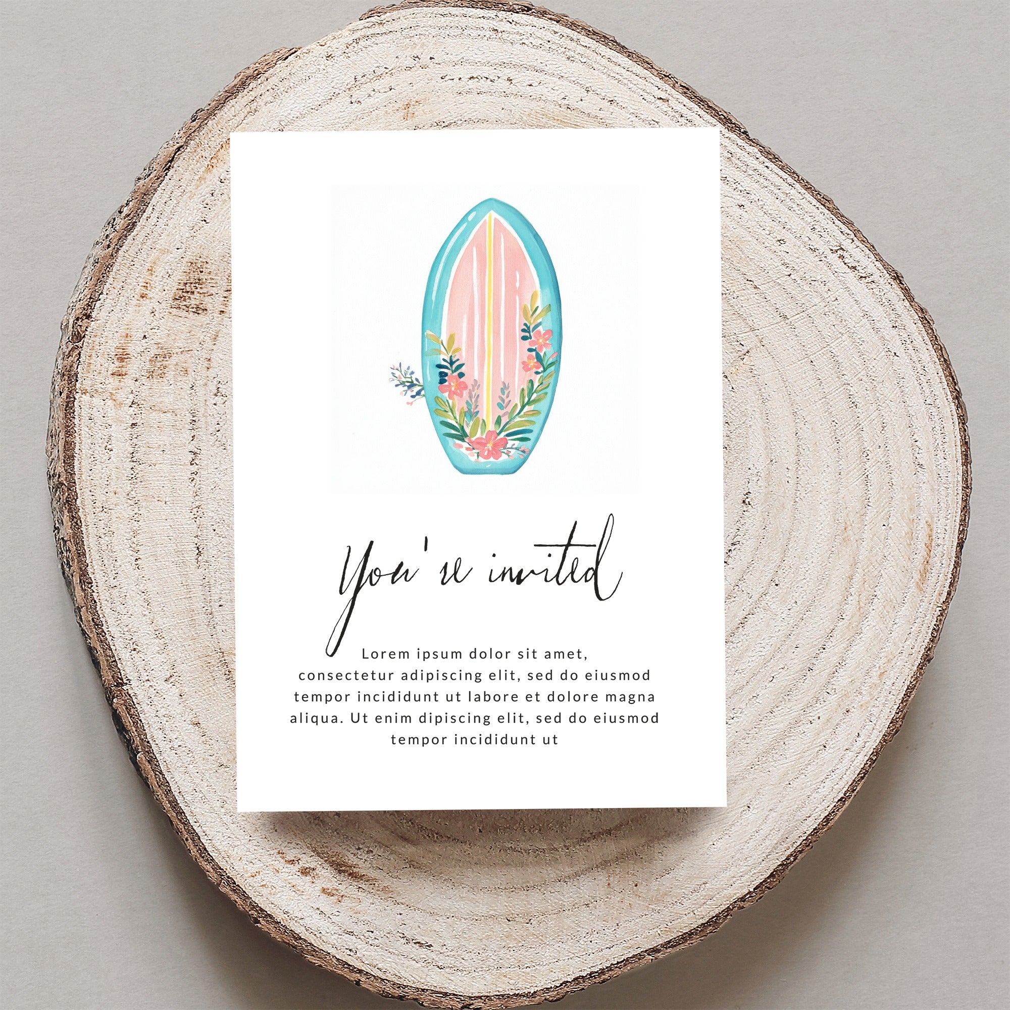 Invitation with floral surfboard and "You're invited" text.