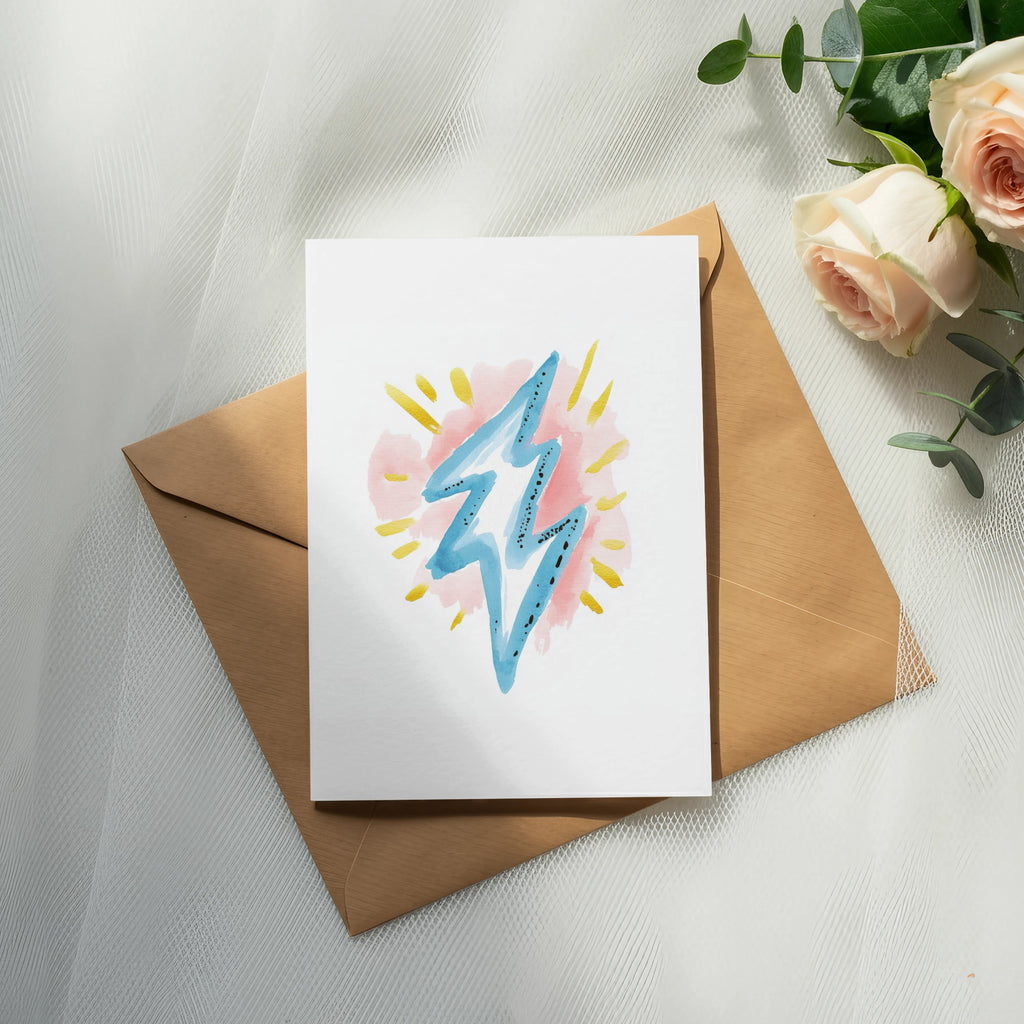 Card with blue lightning bolt on kraft envelope, with roses.