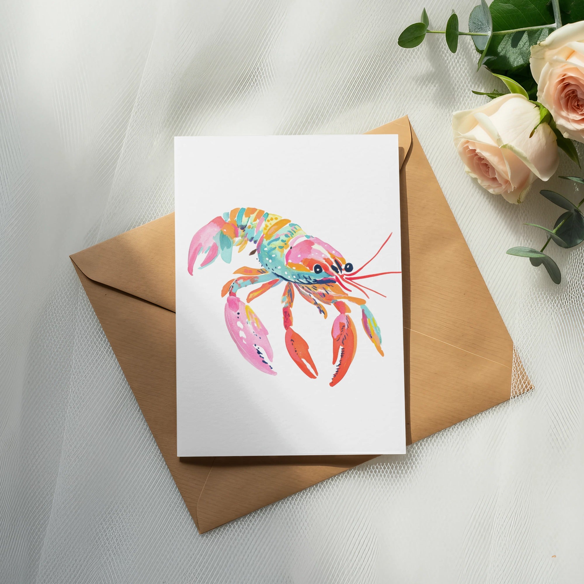 Colorful watercolor lobster on a card with a brown envelope.