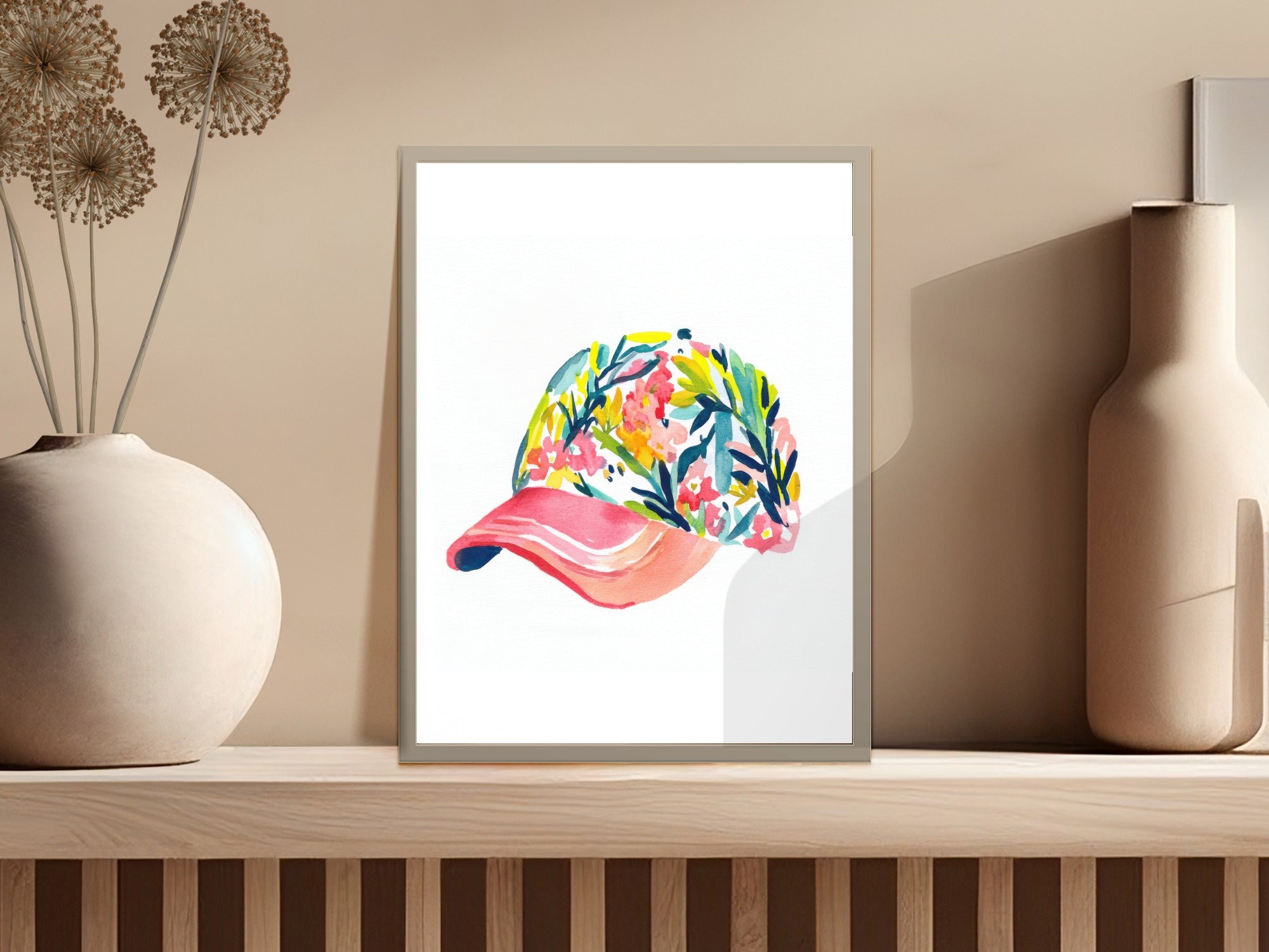 Watercolor painting of a floral baseball cap on a shelf.