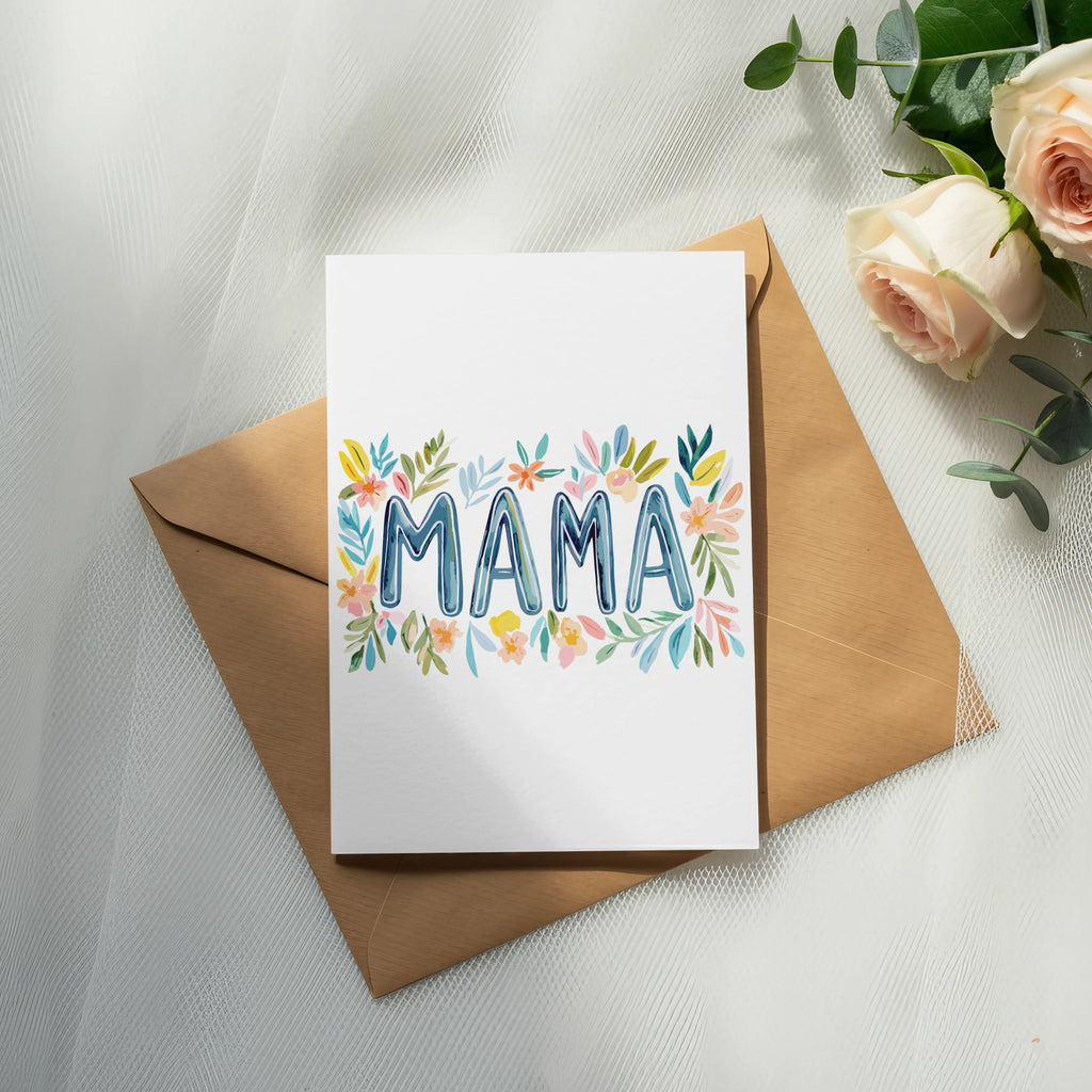Greeting card with "MAMA" written in colorful watercolor flowers on an envelope.