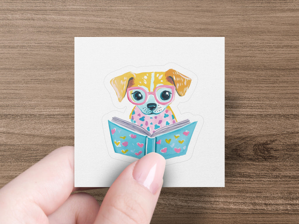 A cute dog wearing pink glasses reads a book with hearts.