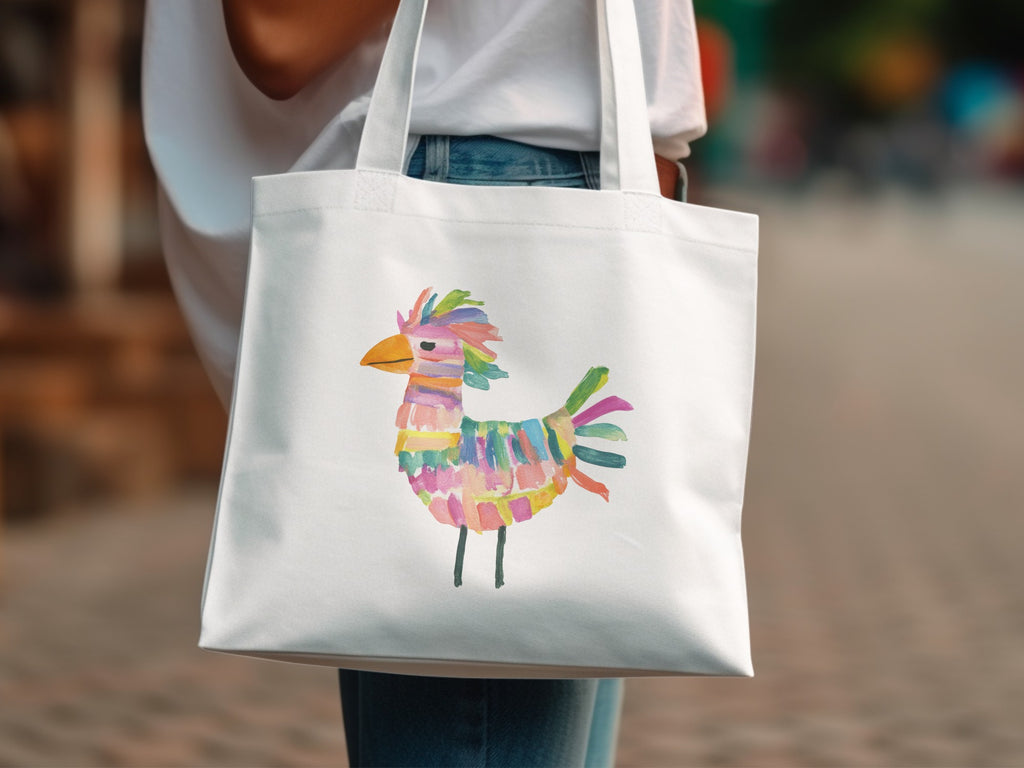 White canvas tote bag with colorful abstract bird illustration.