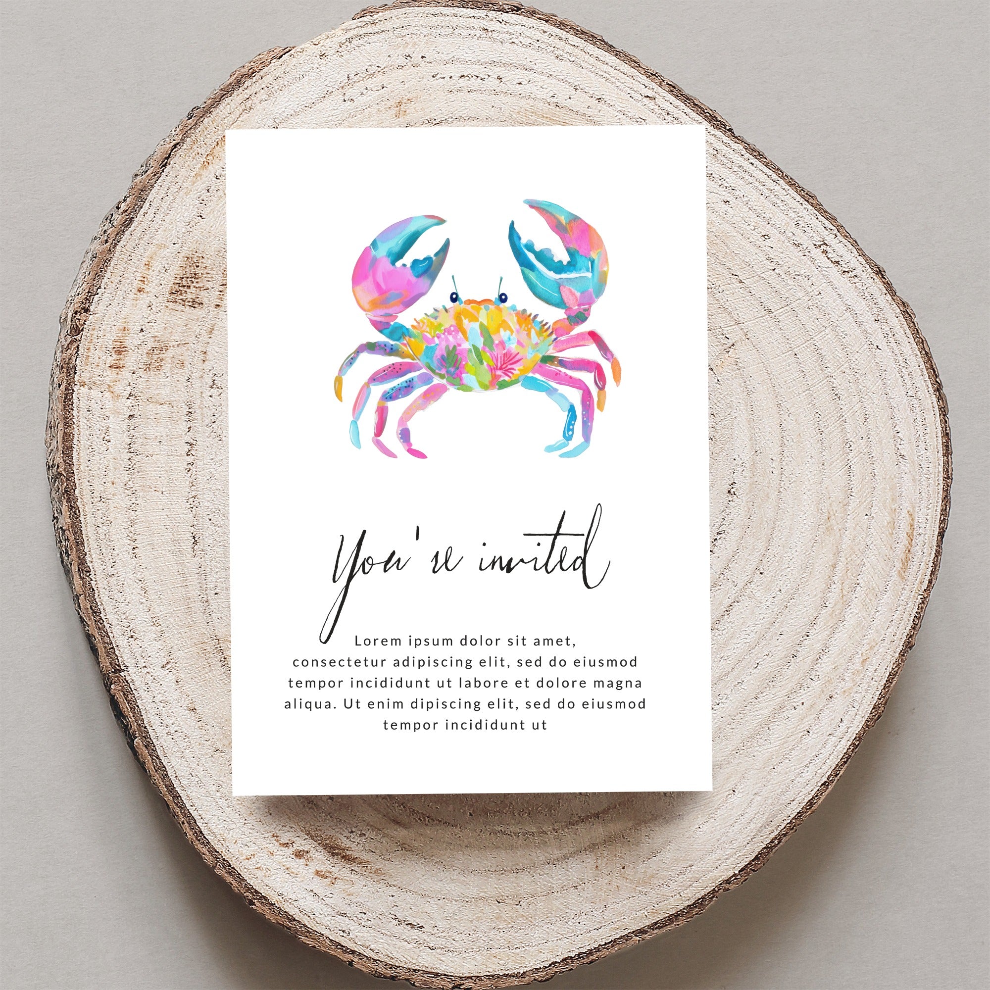 Watercolor crab illustration on an invitation with "You're invited" text.
