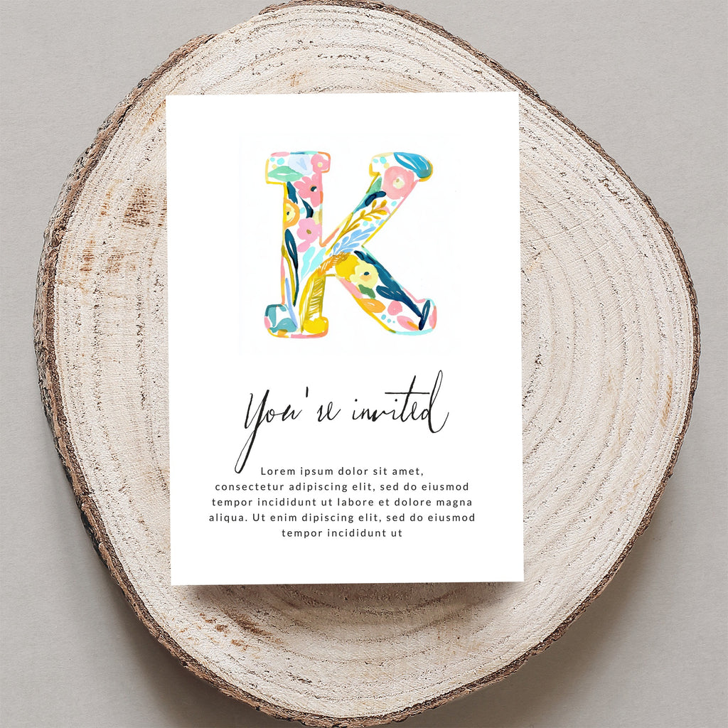 Invitation with large floral "K" and "You're invited" text.