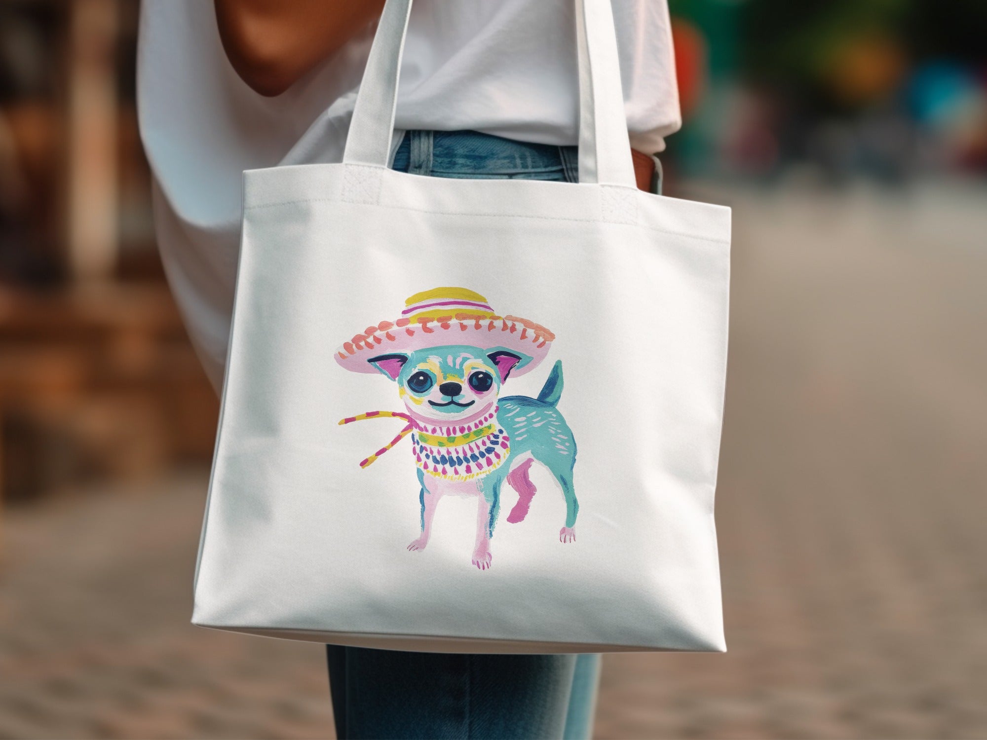 White tote bag with colorful illustrated chihuahua wearing a sombrero and bandana.
