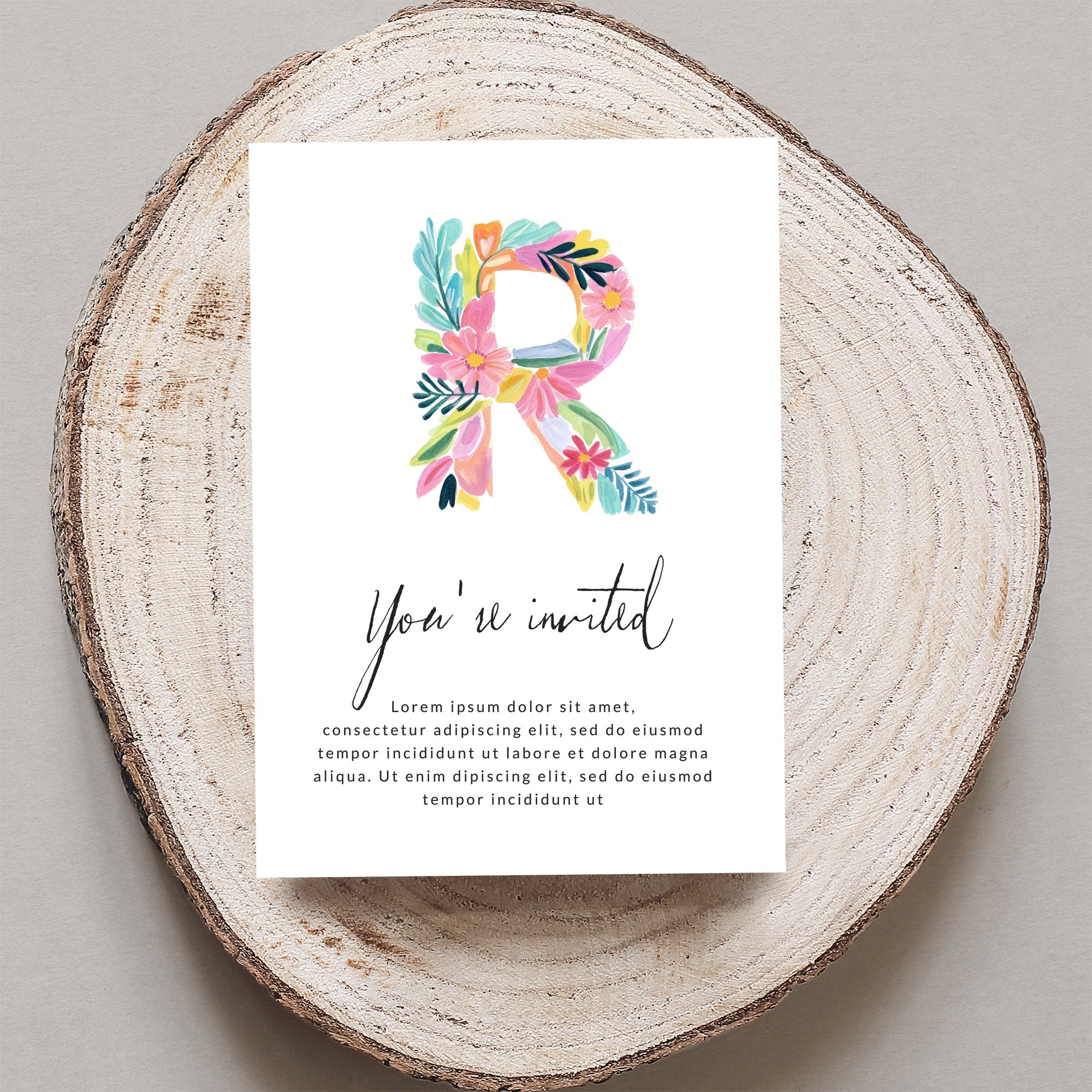Floral letter R invitation with "You're invited" text.