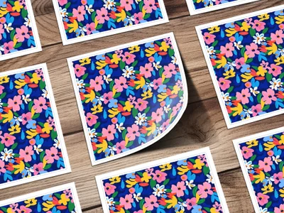 Scattered floral pattern cards on a wooden background.