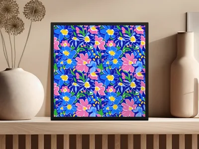 Framed floral art with blue and pink flowers on a dark blue background.
