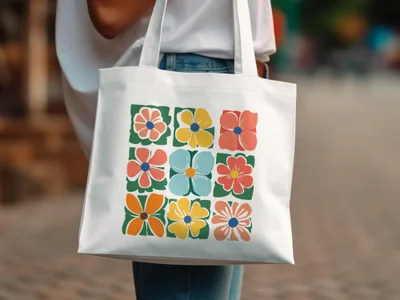 White tote bag with grid of colorful floral illustrations.