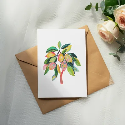 Watercolor illustration of a lemon tree on a card, with a kraft envelope.