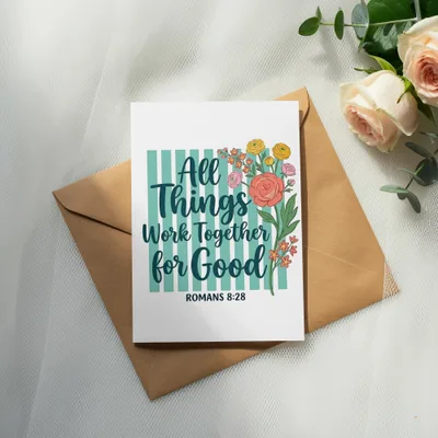 Greeting card with floral design and text "All Things Work Together for Good, Romans 8:28".