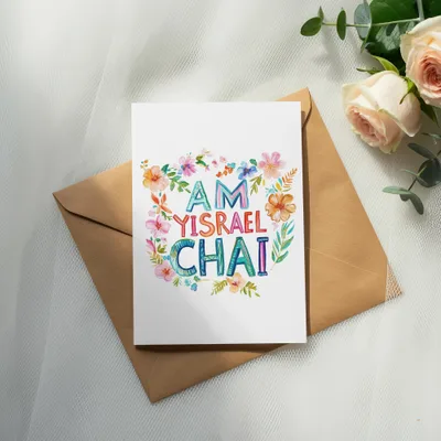 Card with "AM YISRAEL CHAI" written in colorful floral letters on an envelope.