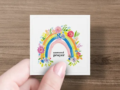 Square card with a rainbow and flowers, reading "answered prayer."